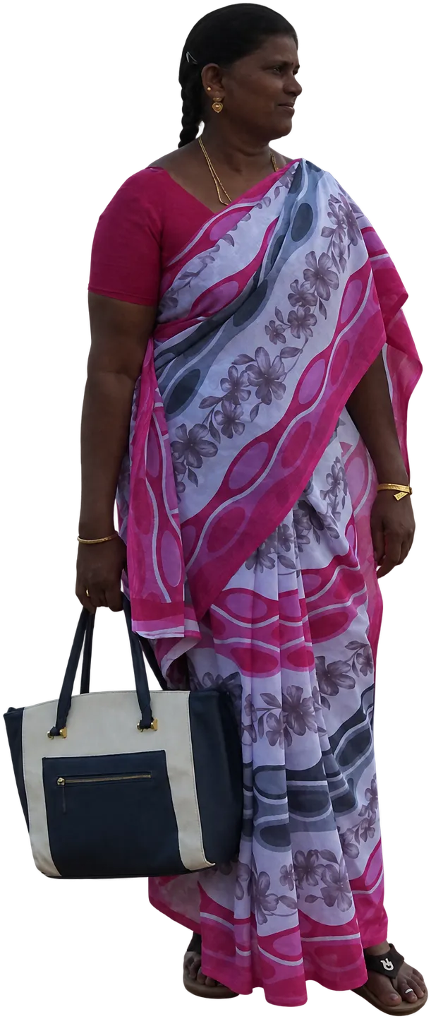 A woman in a pink sari walking the promenade at Marina Park, Port Blair