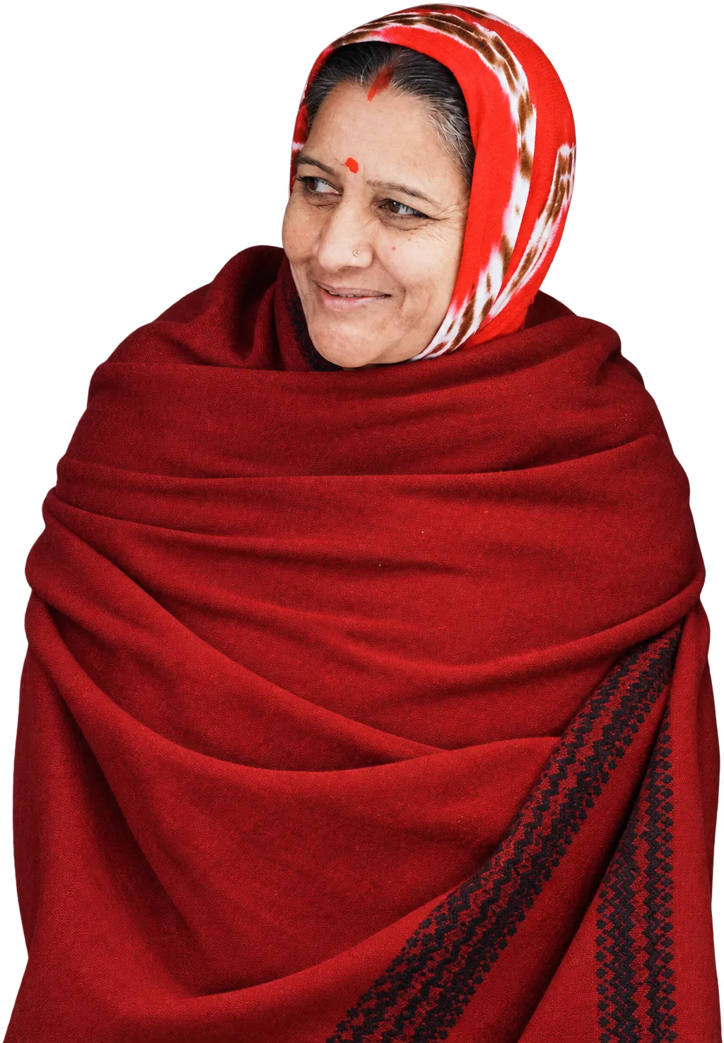 A woman in a red shawl, smiling