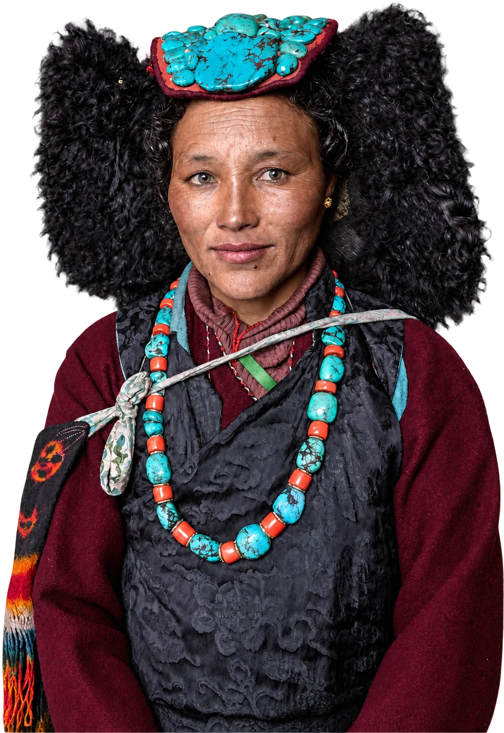 A Ladakhi woman in a turquoise perak and coral necklace