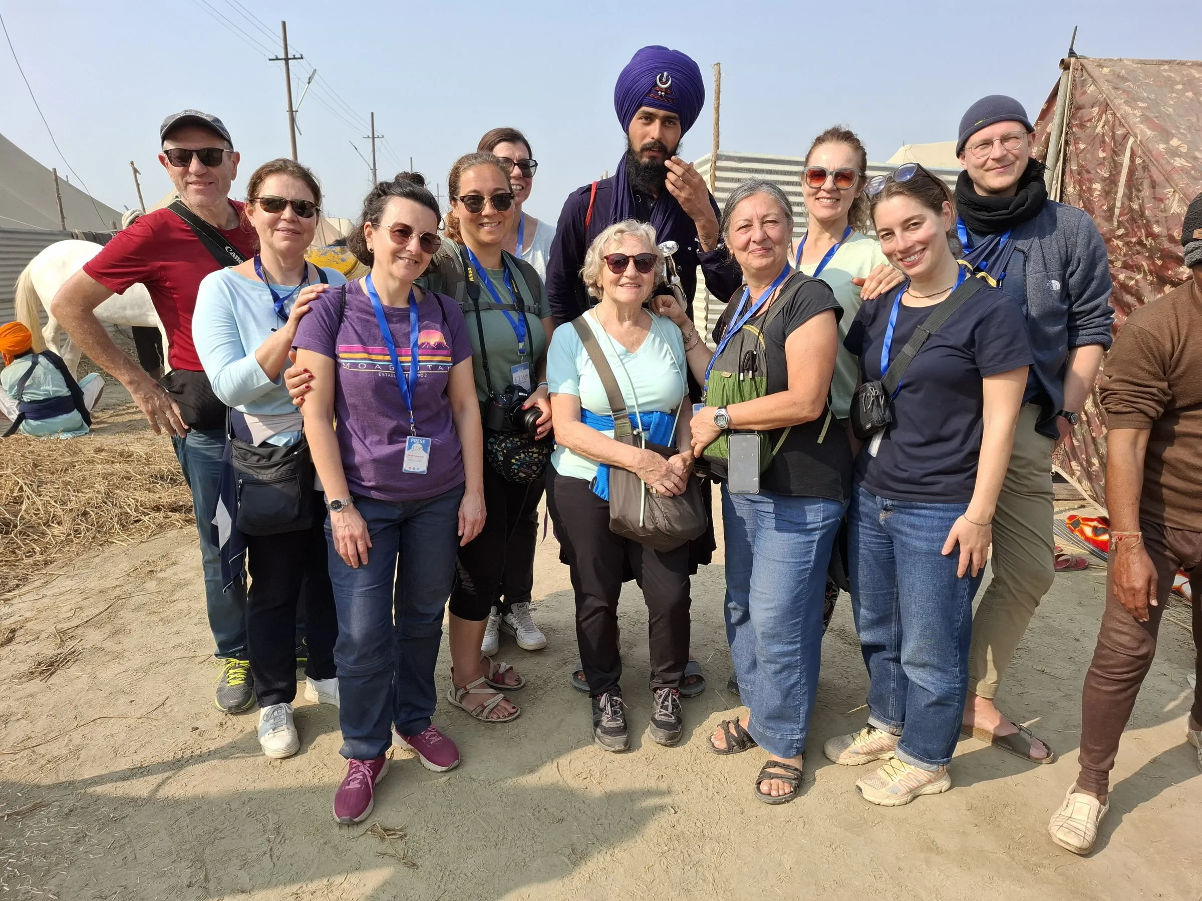 Travellers with the team on the sands of the Kumbh