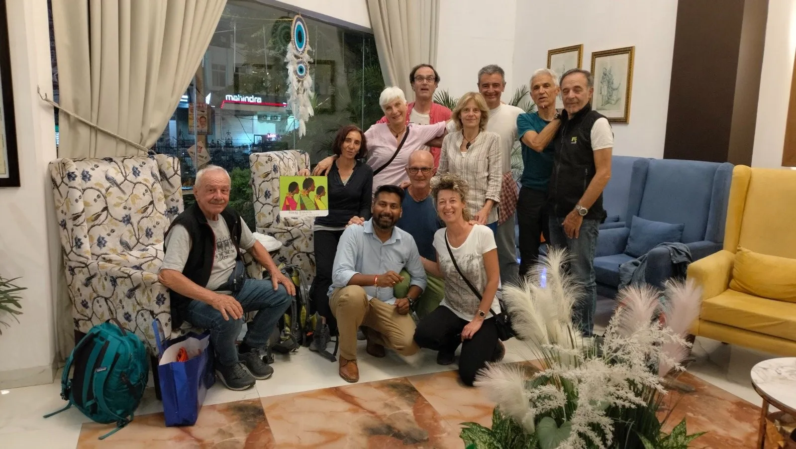 A group of travellers with the team in a hotel lobby
