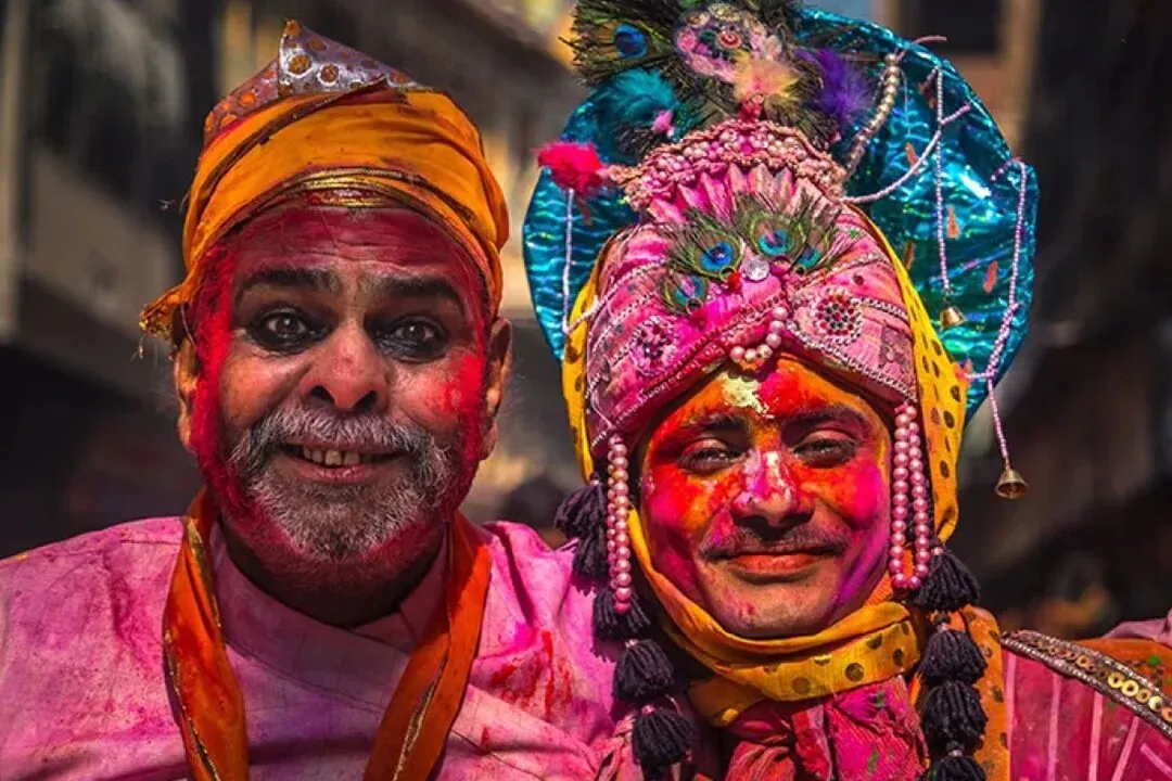 Faces covered in colour at Lathmar Holi, Barsana