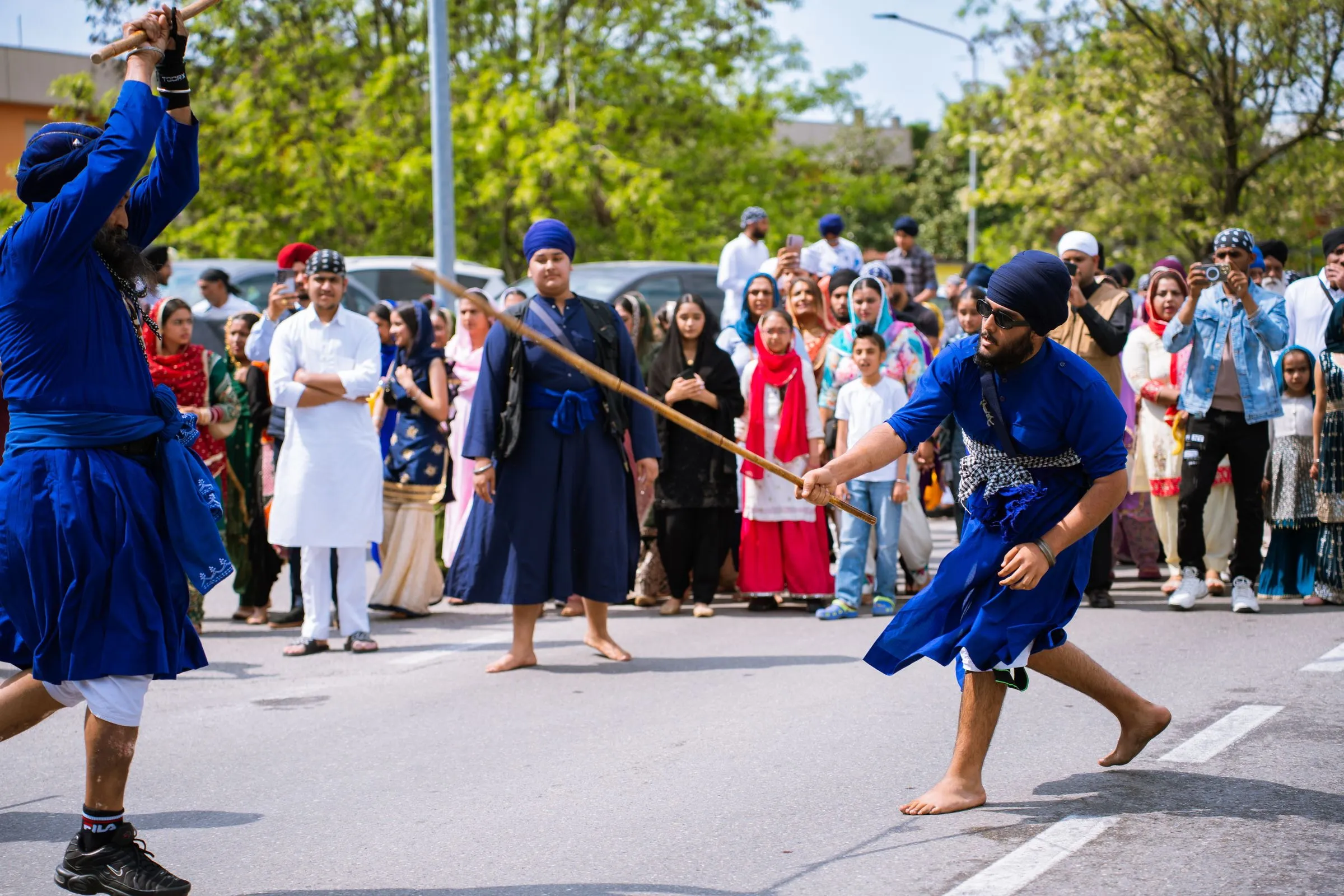 Nihang Sikhs in blue at the gatka in the street, Hola Mohalla