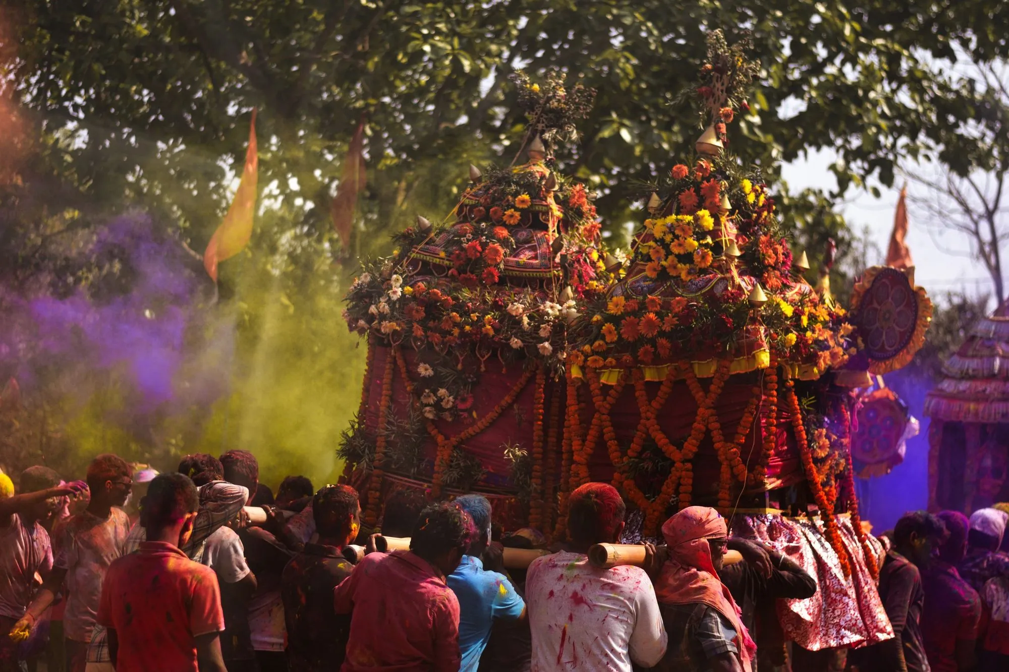 A Holi procession under clouds of colour