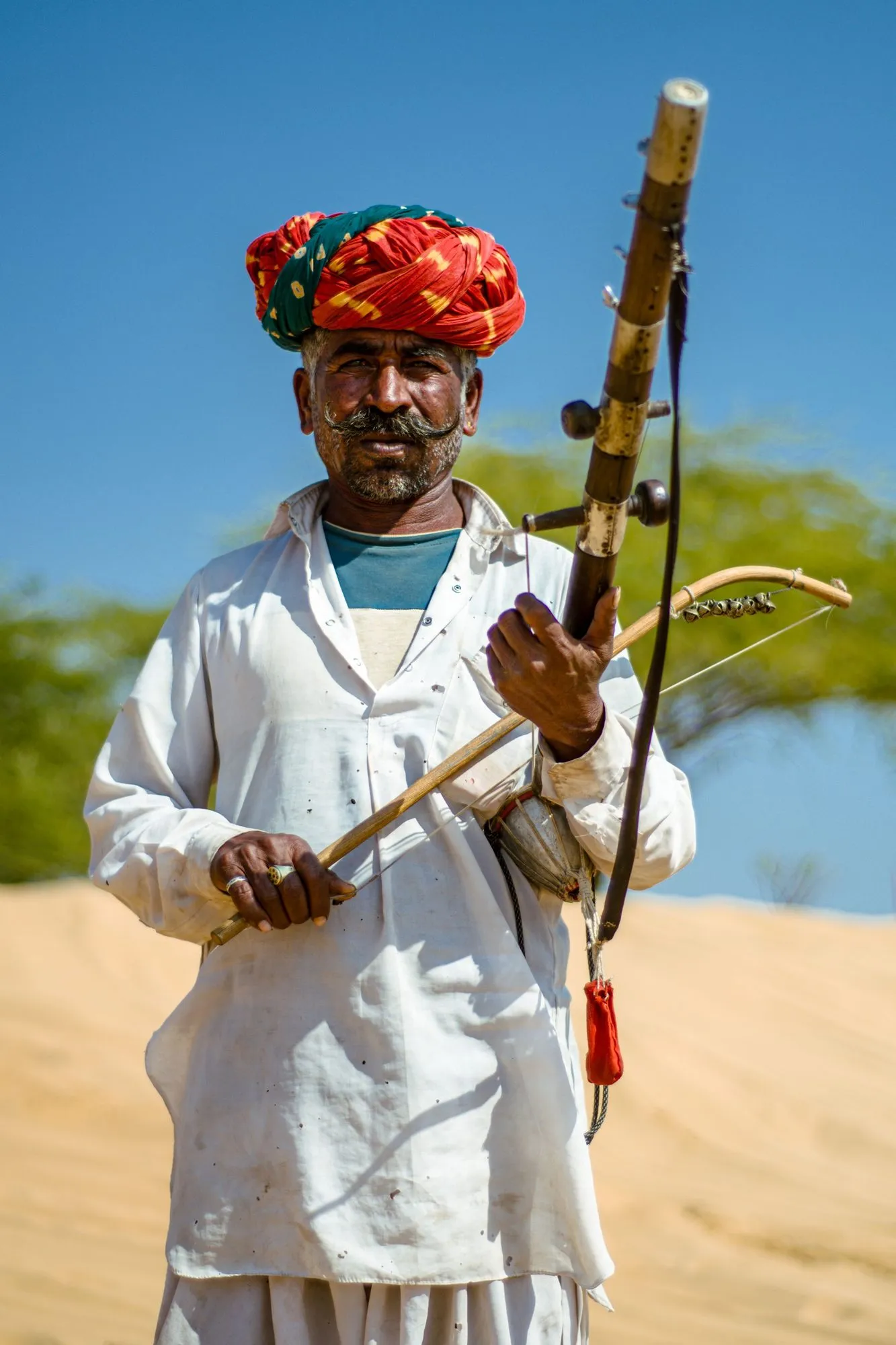 A Rajasthani musician in a red turban with his bowed ravanhatha