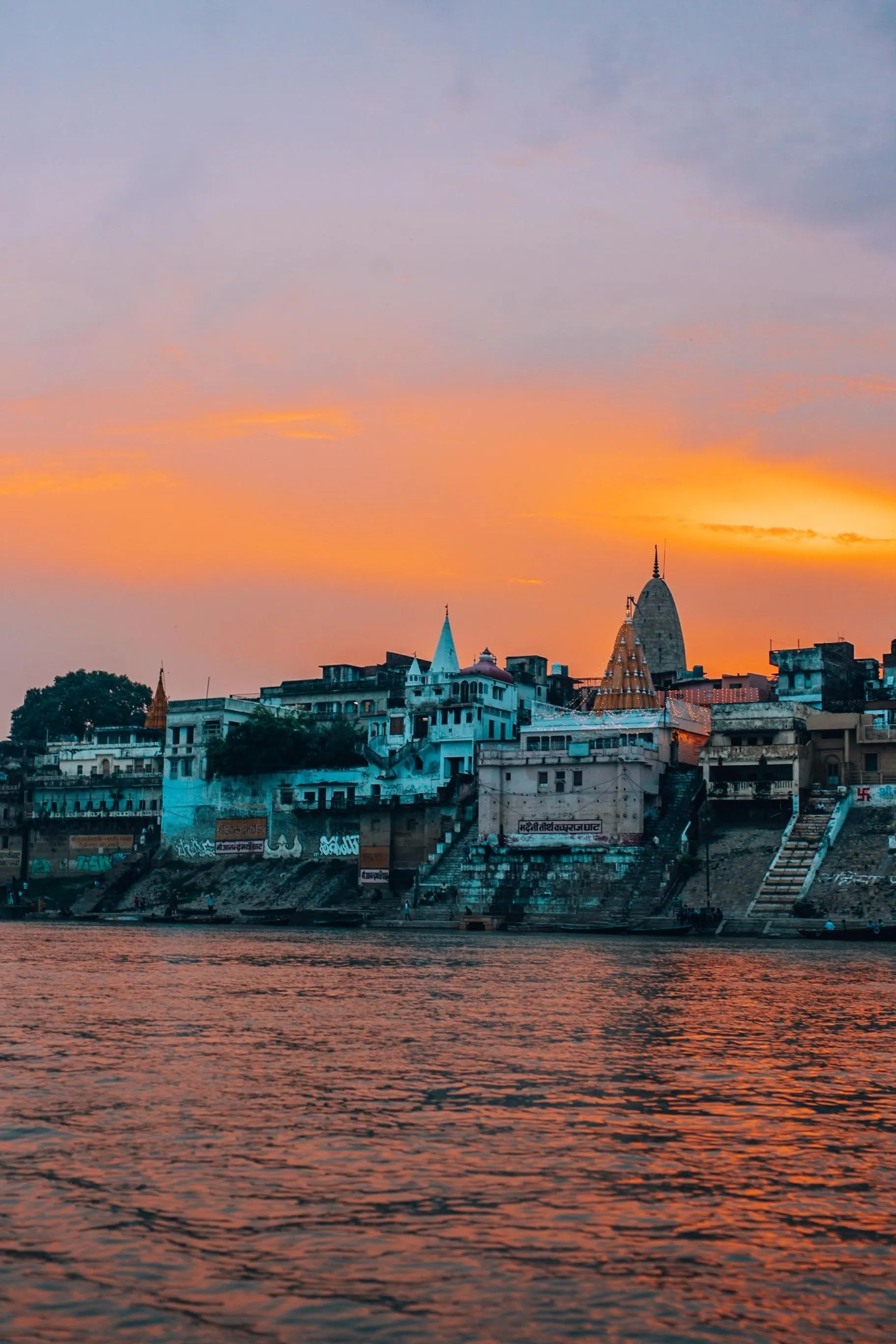 Varanasi ghats at sunset seen from the river
