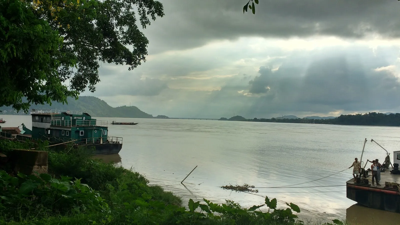 Ferry boats on the Brahmaputra at Guwahati under a gathering sky