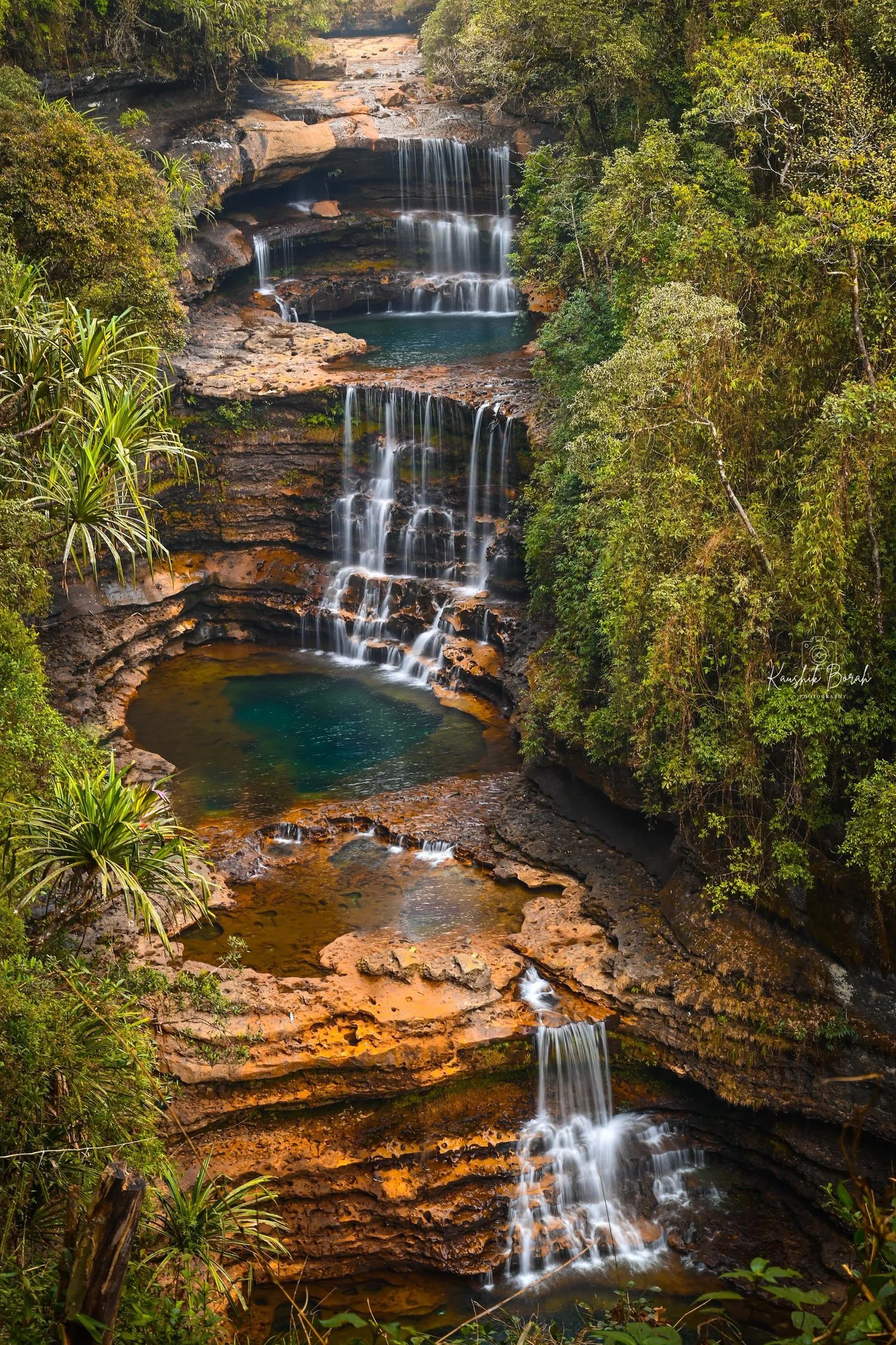 The three tiers and blue pools of Wei Sawdong falls near Cherrapunji