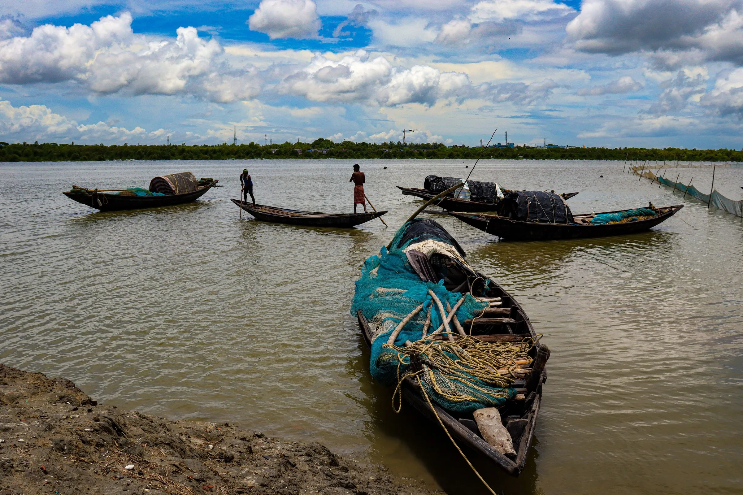 Fishing boats with their nets on the river at Canning, the gateway to the Sundarbans