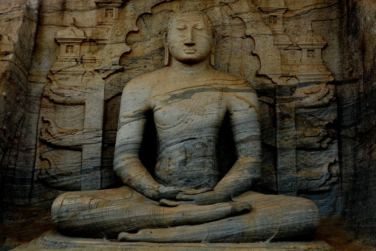 A seated Buddha cut from the granite face of the Gal Vihara, Polonnaruwa