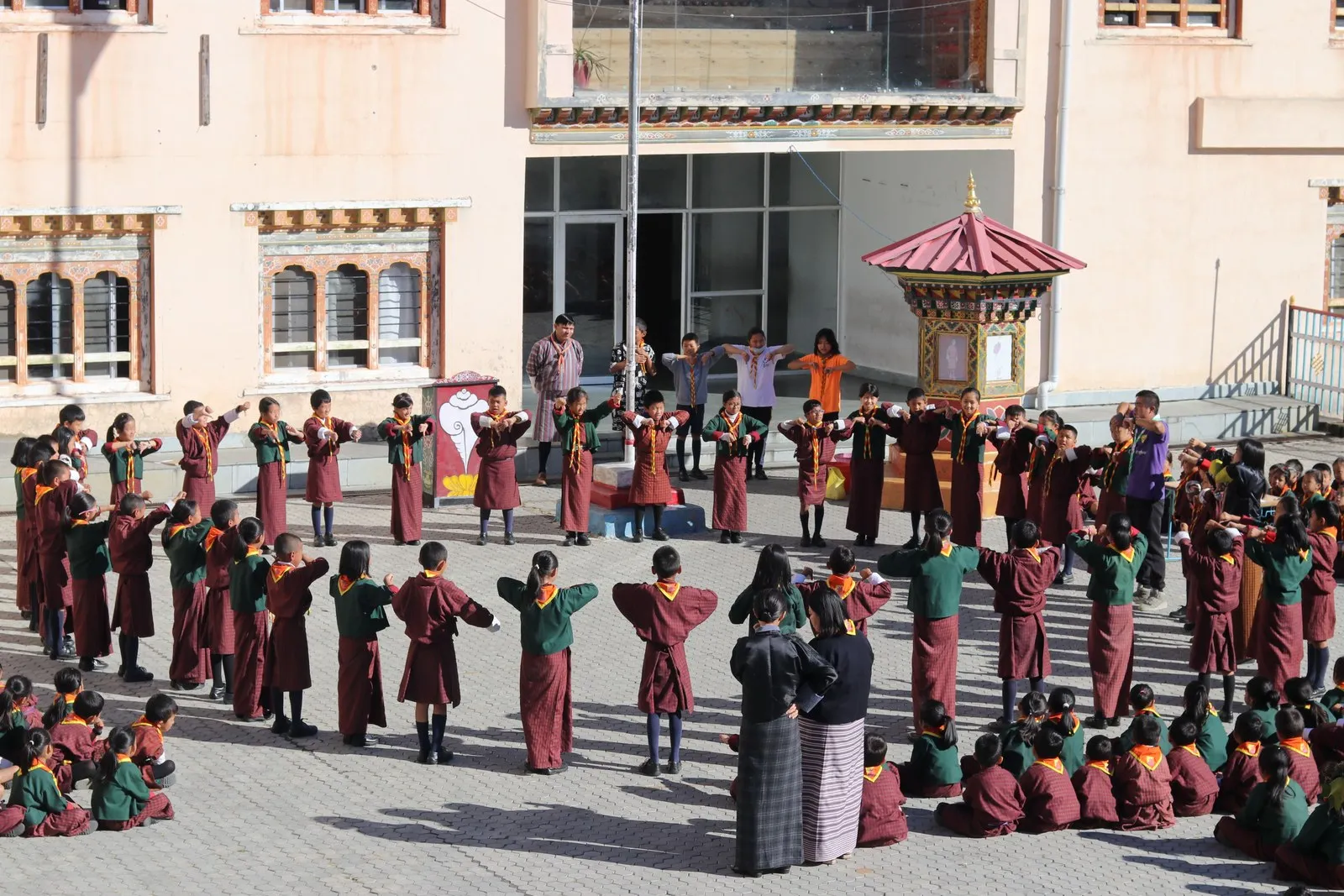 Schoolchildren in gho and kira at a morning assembly in Wangdue Phodrang
