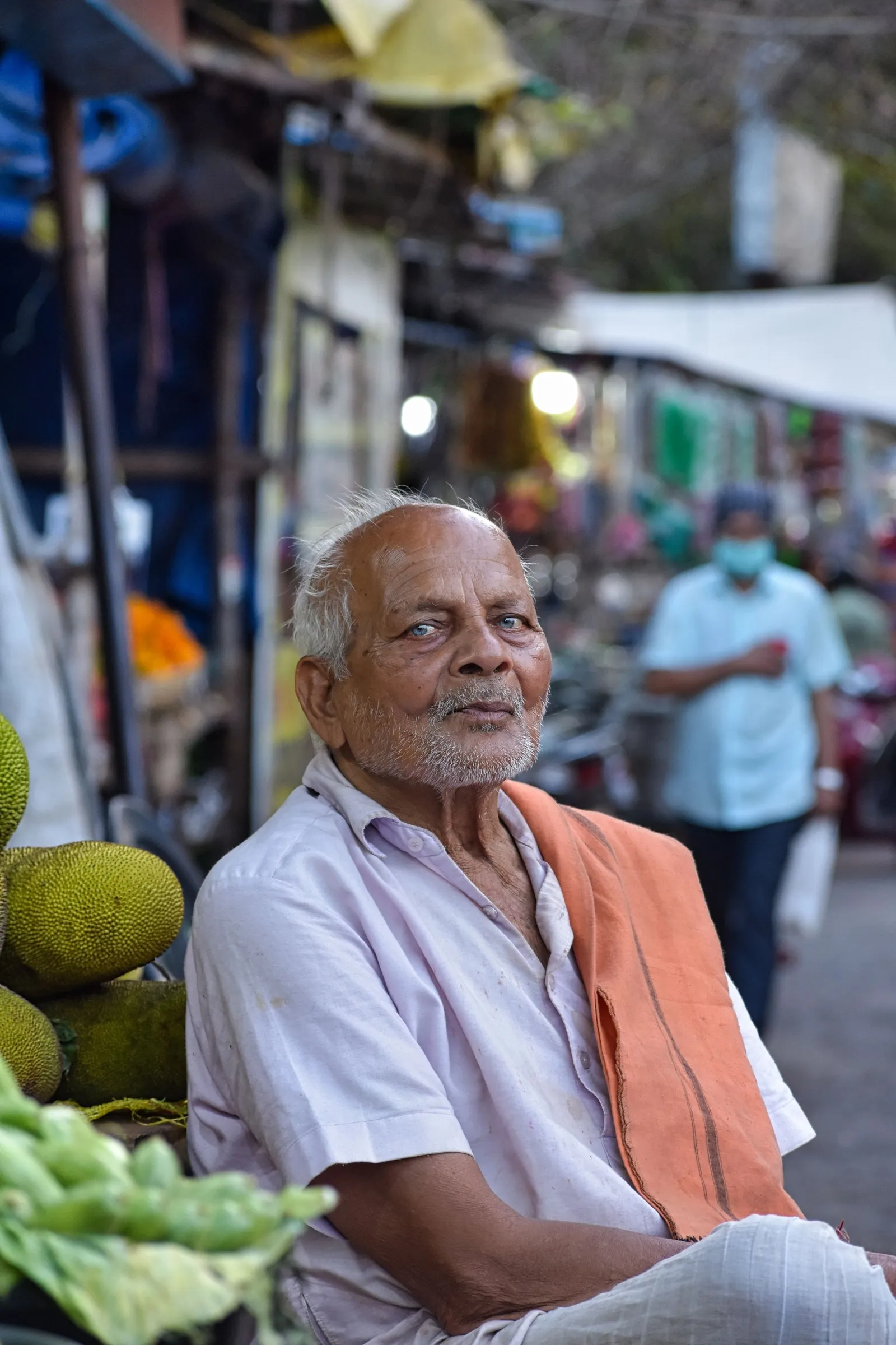 An elderly man at a street market in Bhubaneswar