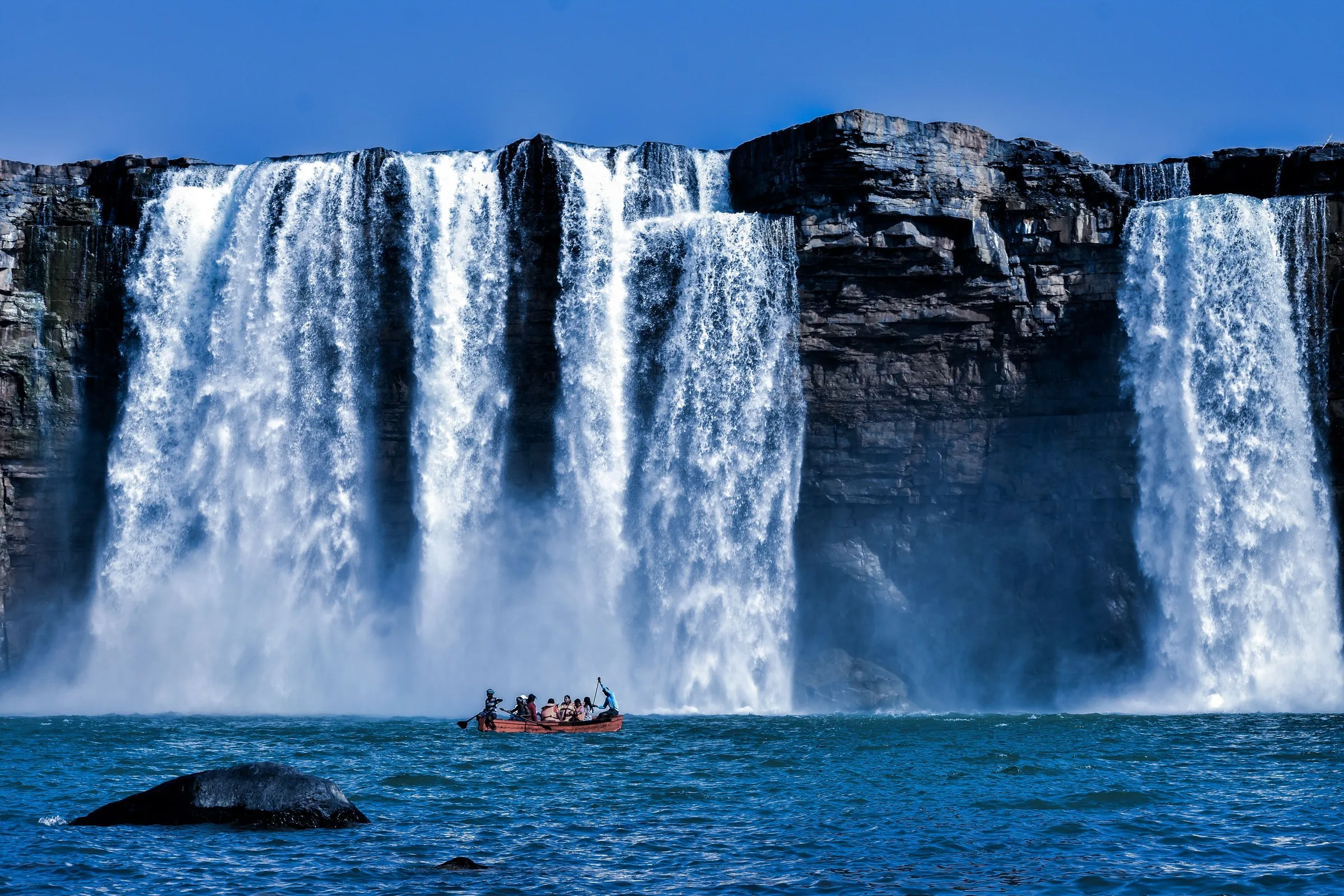 A boat below the Chitrakote Falls on the Indravati river, Bastar