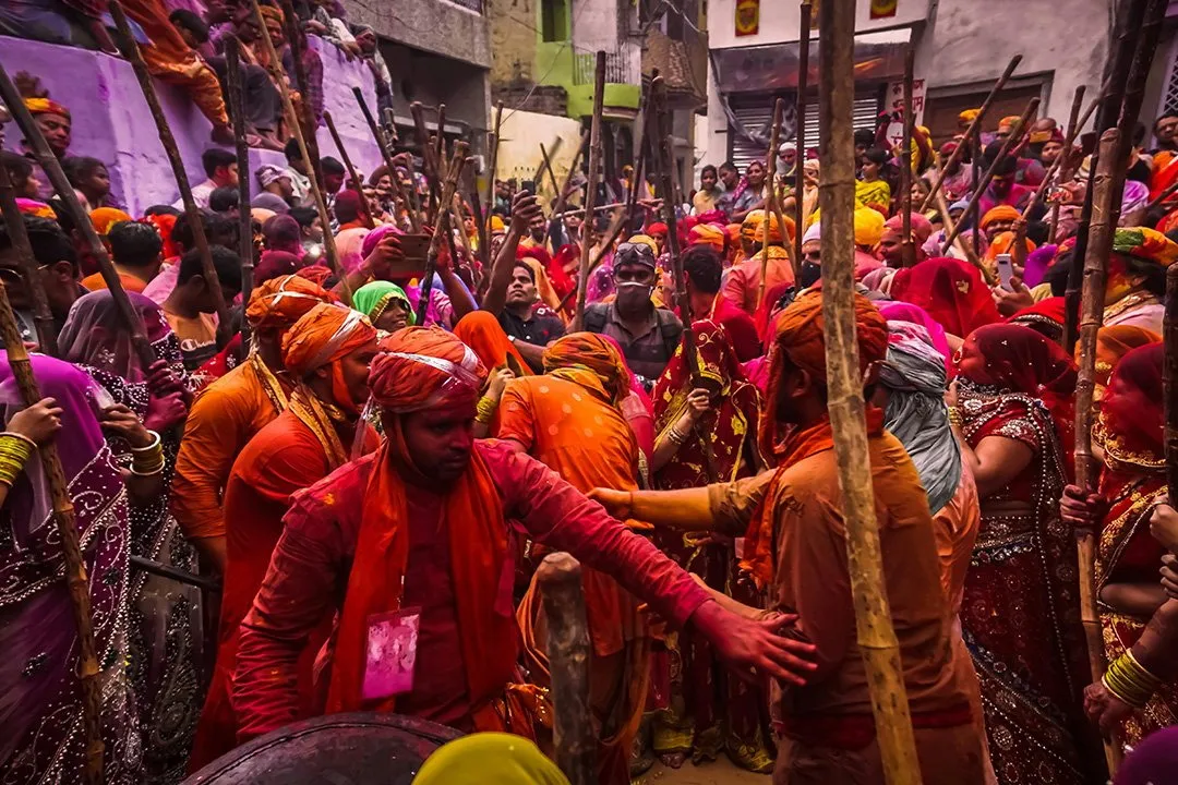 Men and women of Barsana in the thick of the Lathmar Holi