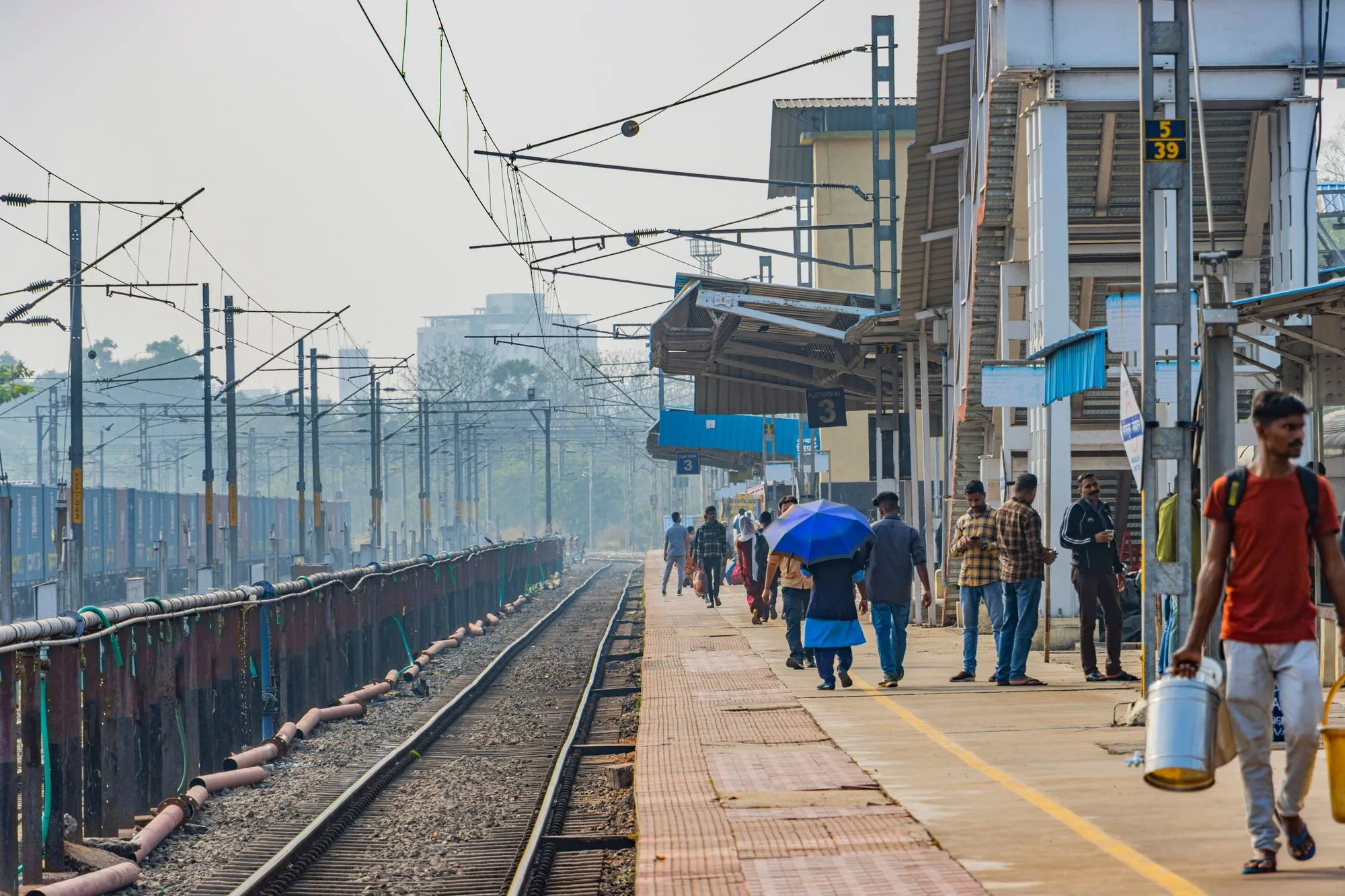 A train platform in the morning haze