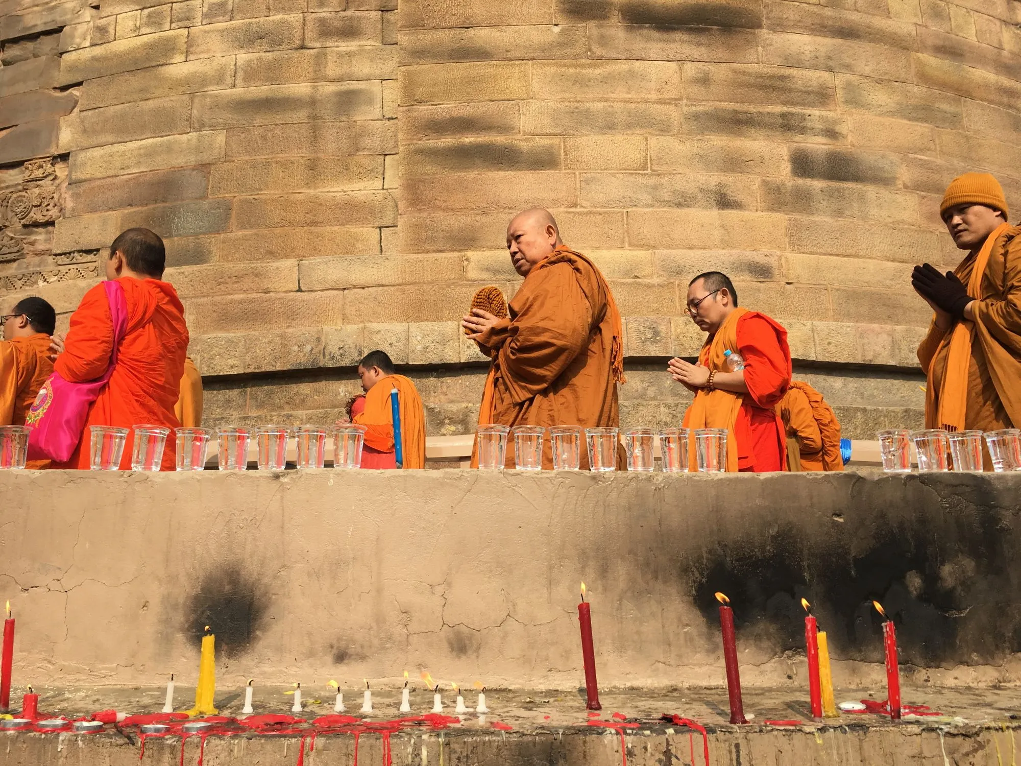 Monks lighting candles at Sarnath