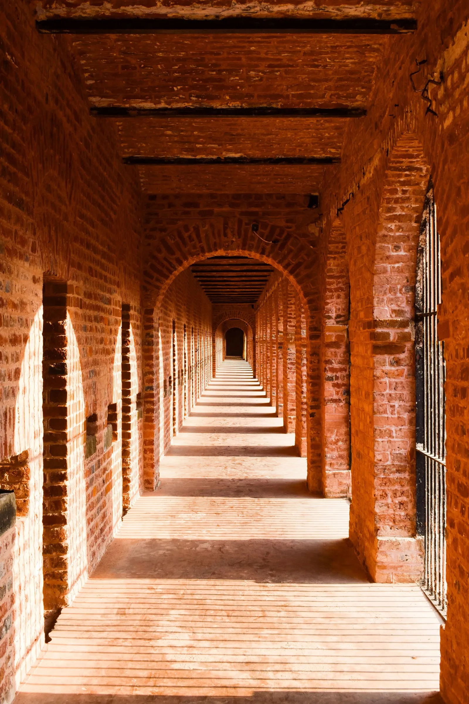 The red-brick corridor of a wing of cells in the Cellular Jail, Port Blair
