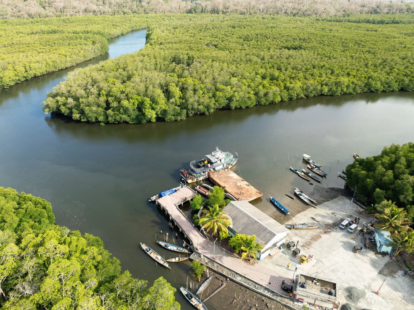 Boats at Yeratta jetty near Rangat, the creek winding away through mangrove forest