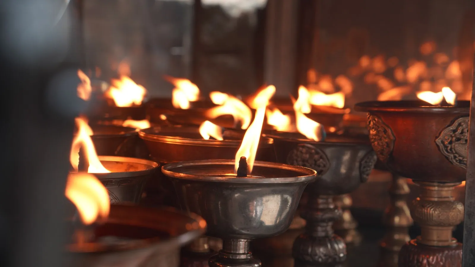 Butter lamps burning in a temple, Bhutan