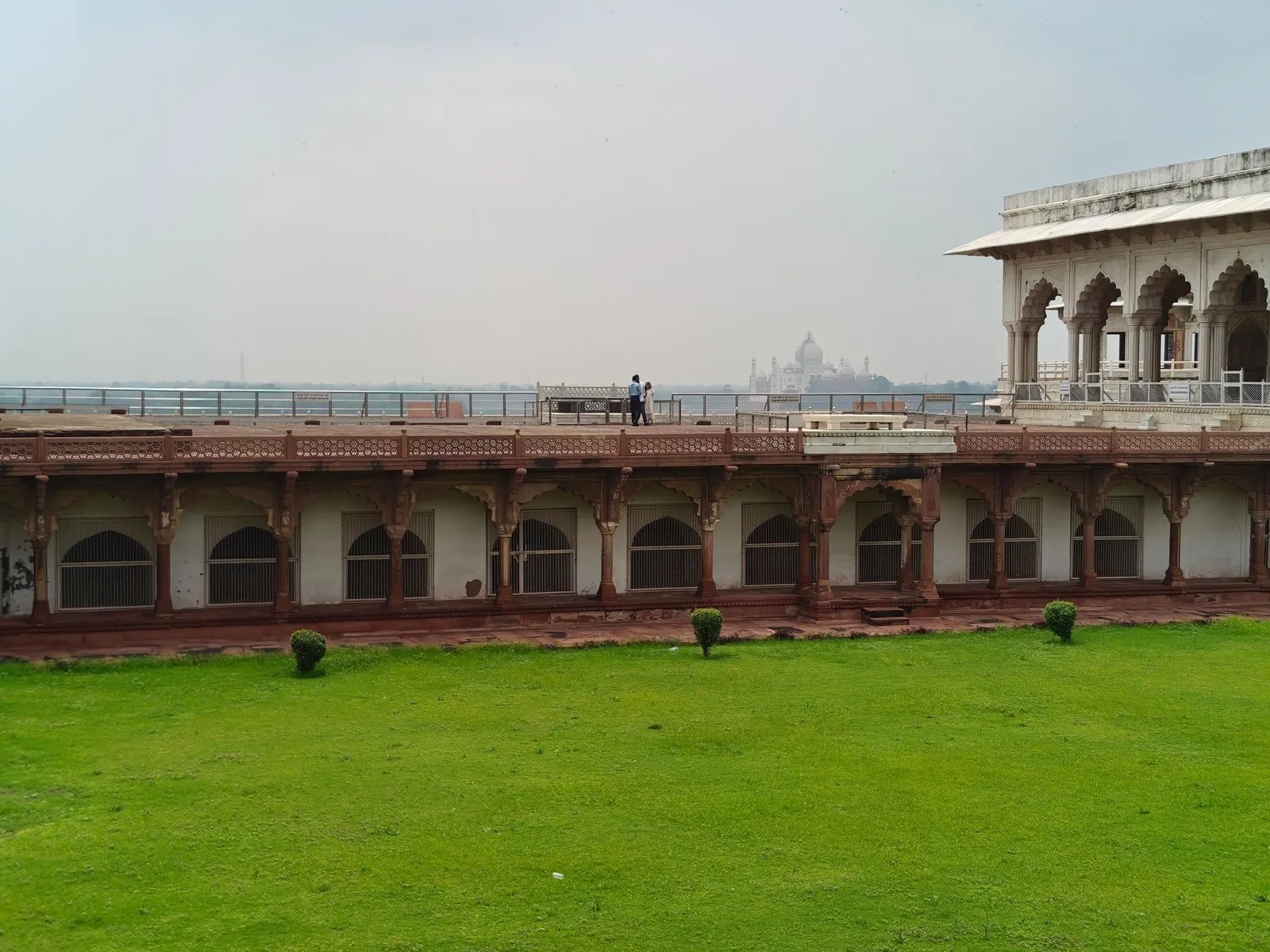 Agra Fort, with the Taj Mahal in the haze beyond