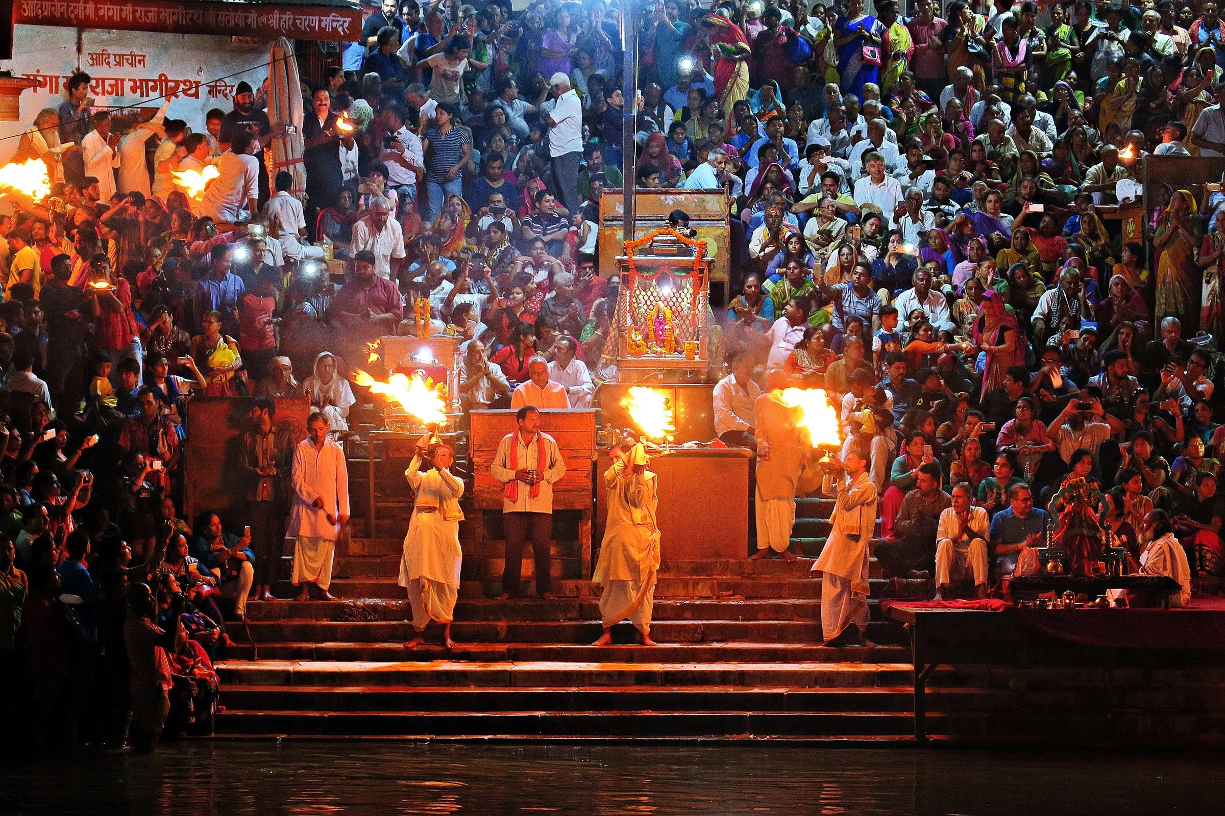 The evening Ganga aarti at Har Ki Pauri, Haridwar: priests with fire lamps before the crowd