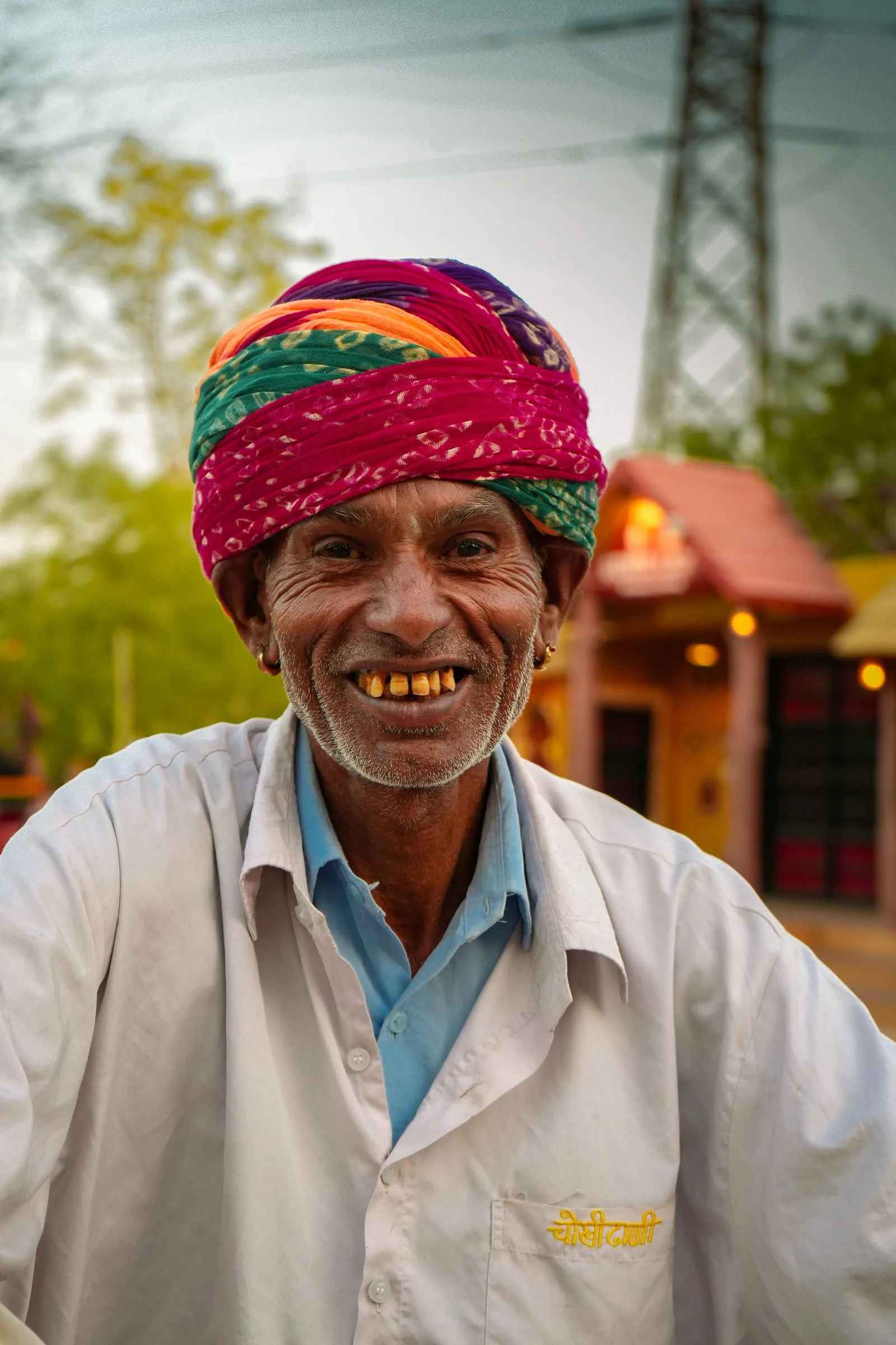 A man in a bright turban, smiling, in Jaipur