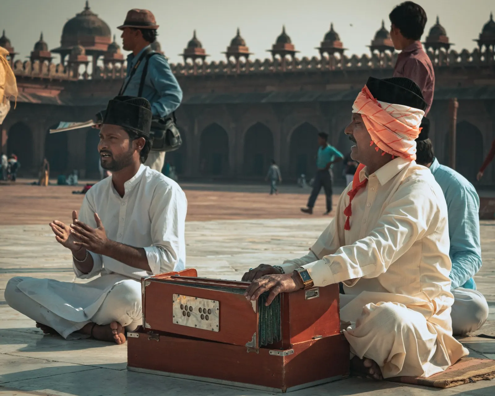 Qawwals with a harmonium in the mosque courtyard at Fatehpur Sikri