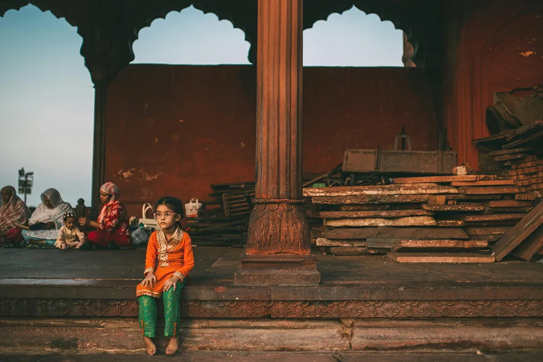 A child in the arcade of an Old Delhi monument
