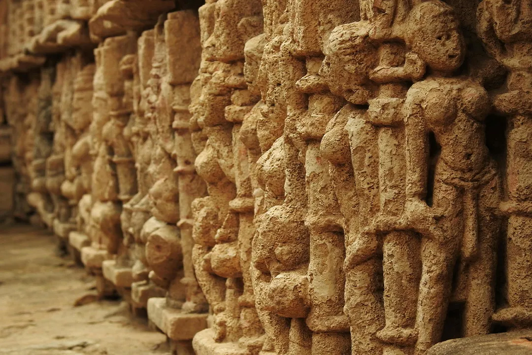 Carved figures along a Khajuraho temple wall