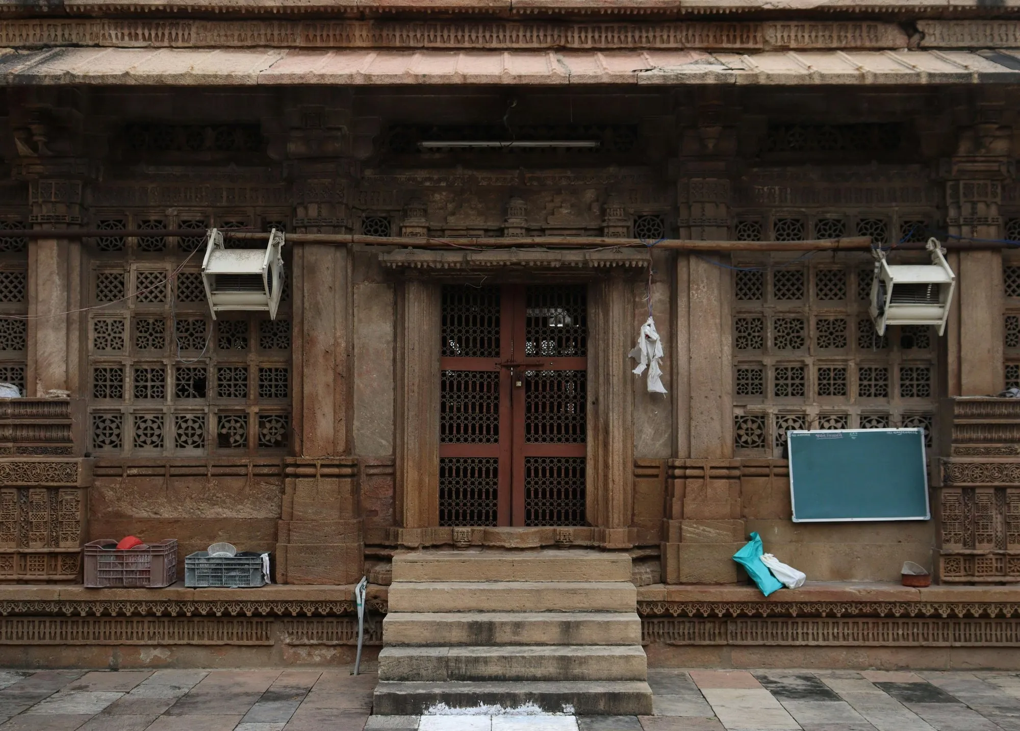 A carved wooden house front in an old Ahmedabad lane