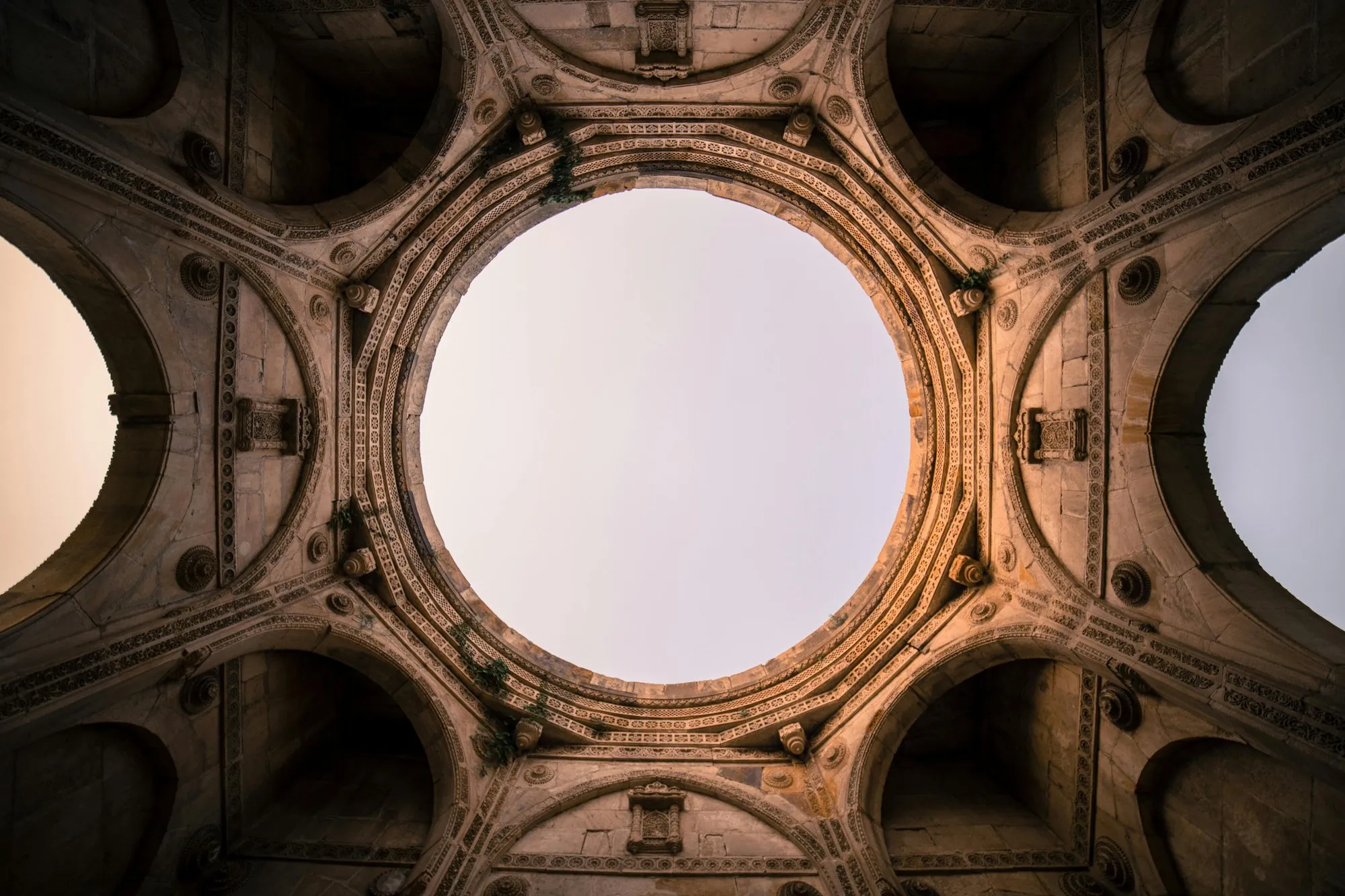 A carved stone dome seen from below