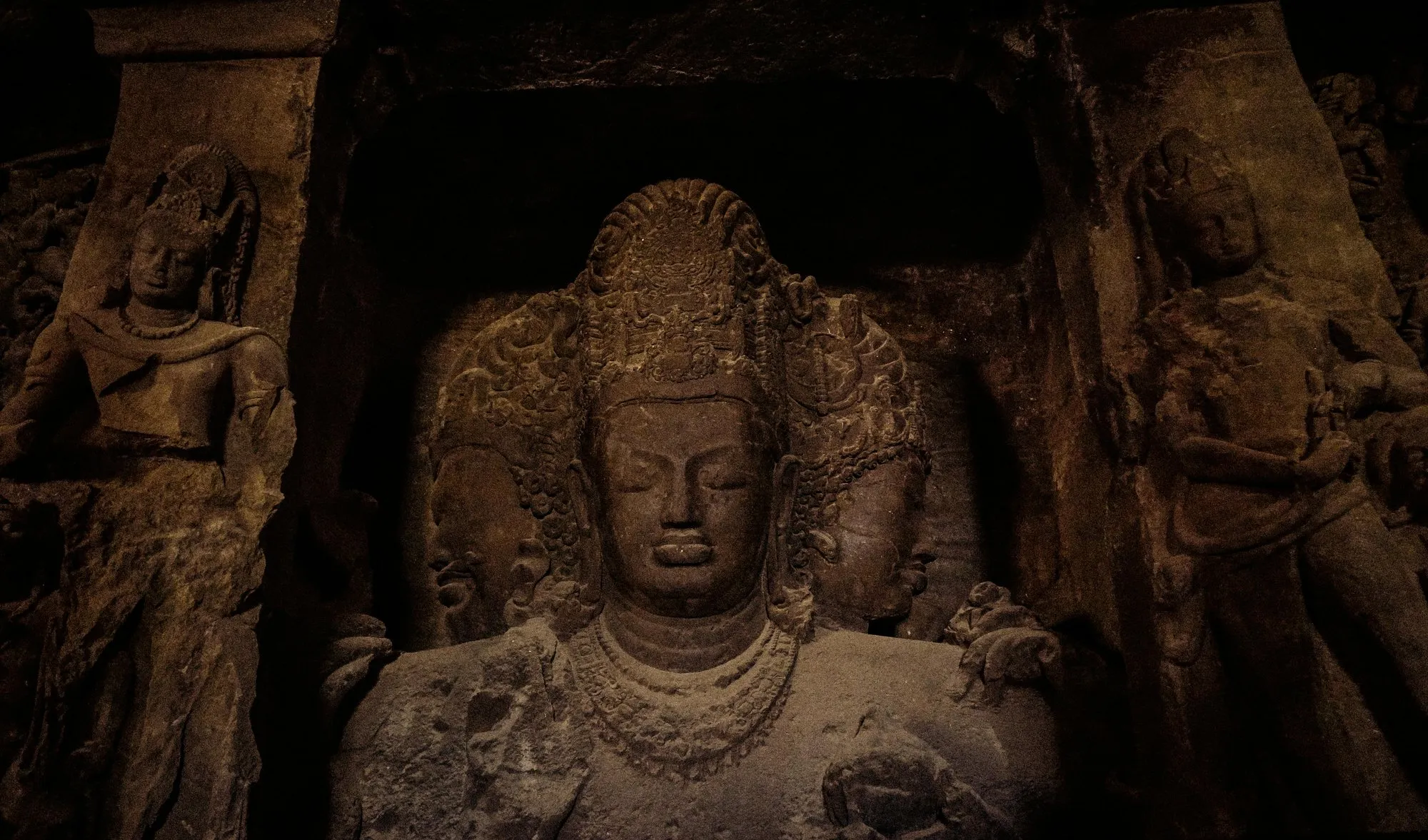 A carved deity in a rock-cut cave