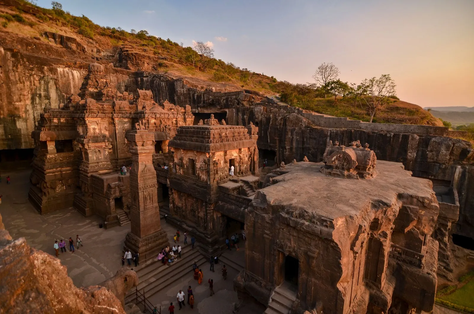 The Kailasa temple at Ellora, cut down into the hillside, at sunset