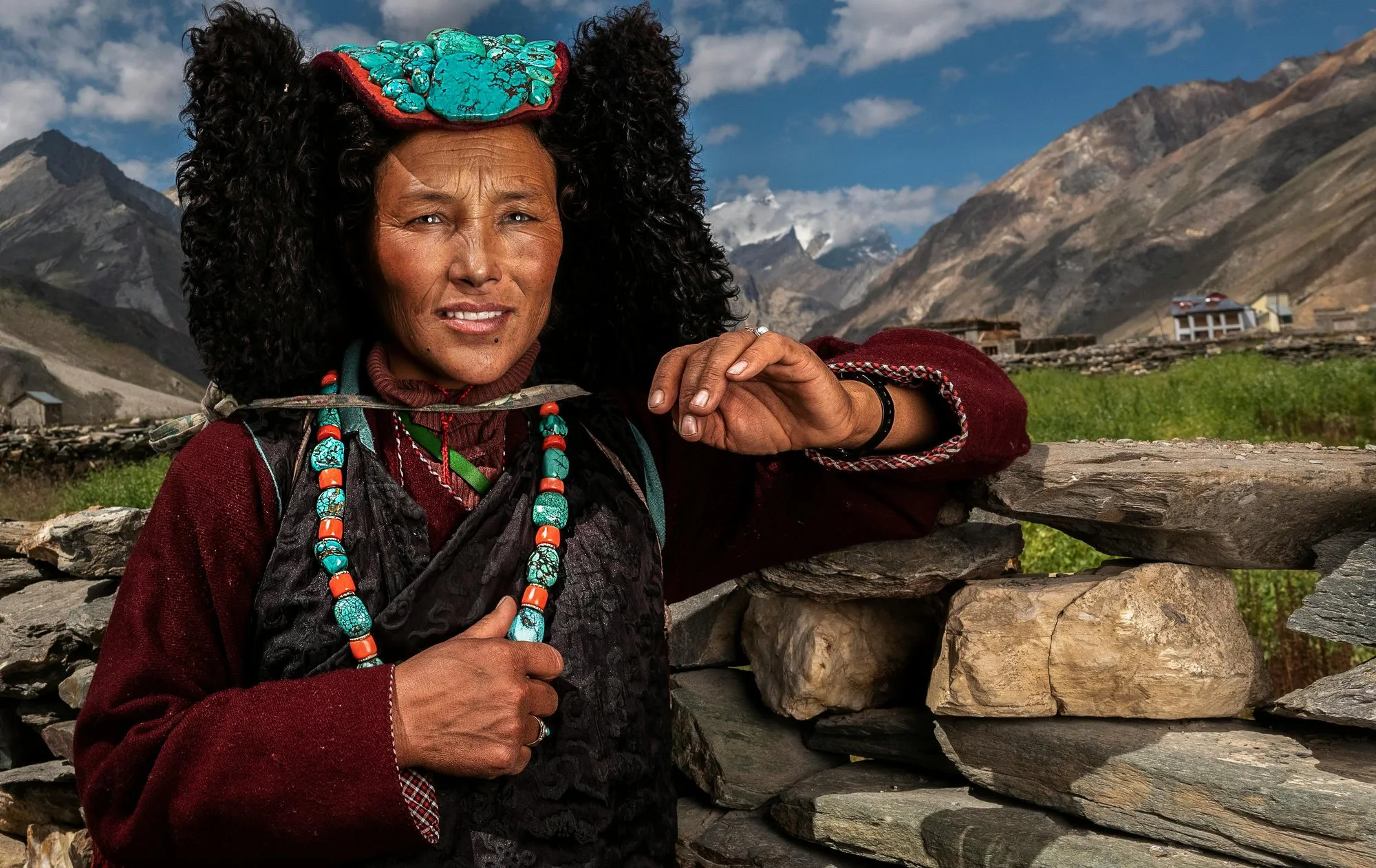 A Ladakhi woman in a turquoise perak and sheepskin earflaps