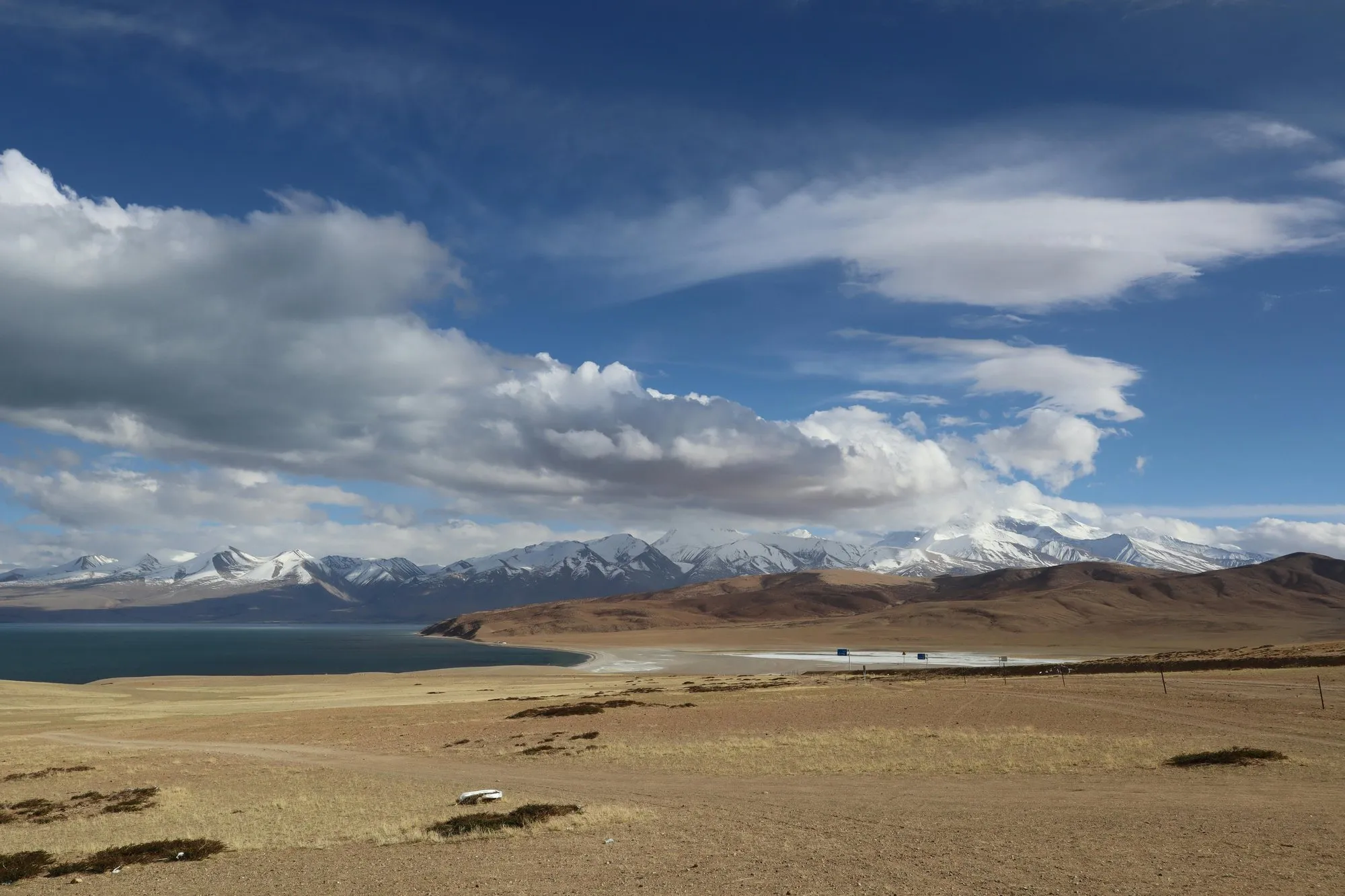 Tso Moriri under a wide sky, snow peaks beyond