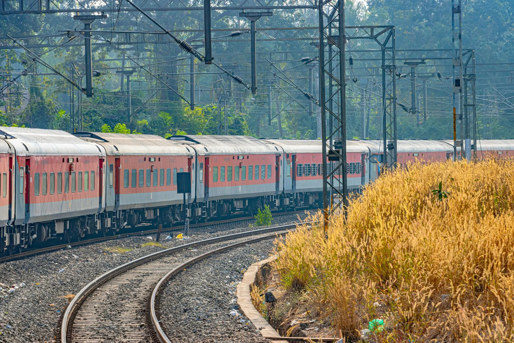 A red train rounding a curve