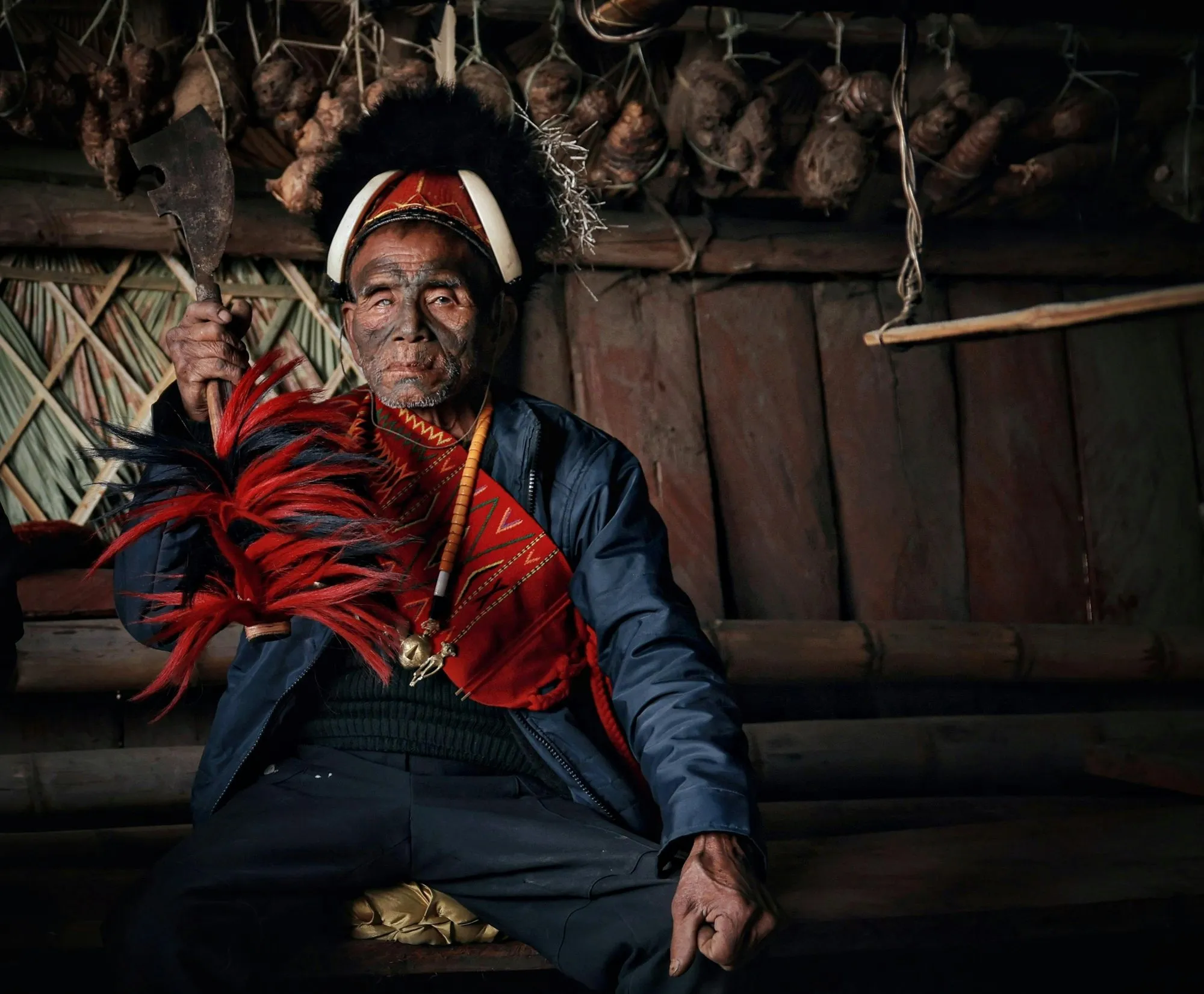 A Konyak elder in a headdress and red shawl