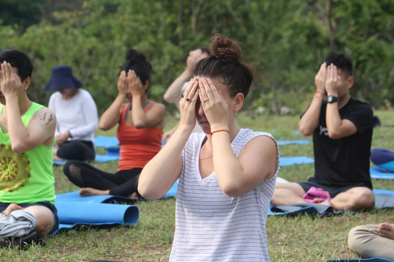 An outdoor class palming the eyes at an ashram near Rishikesh