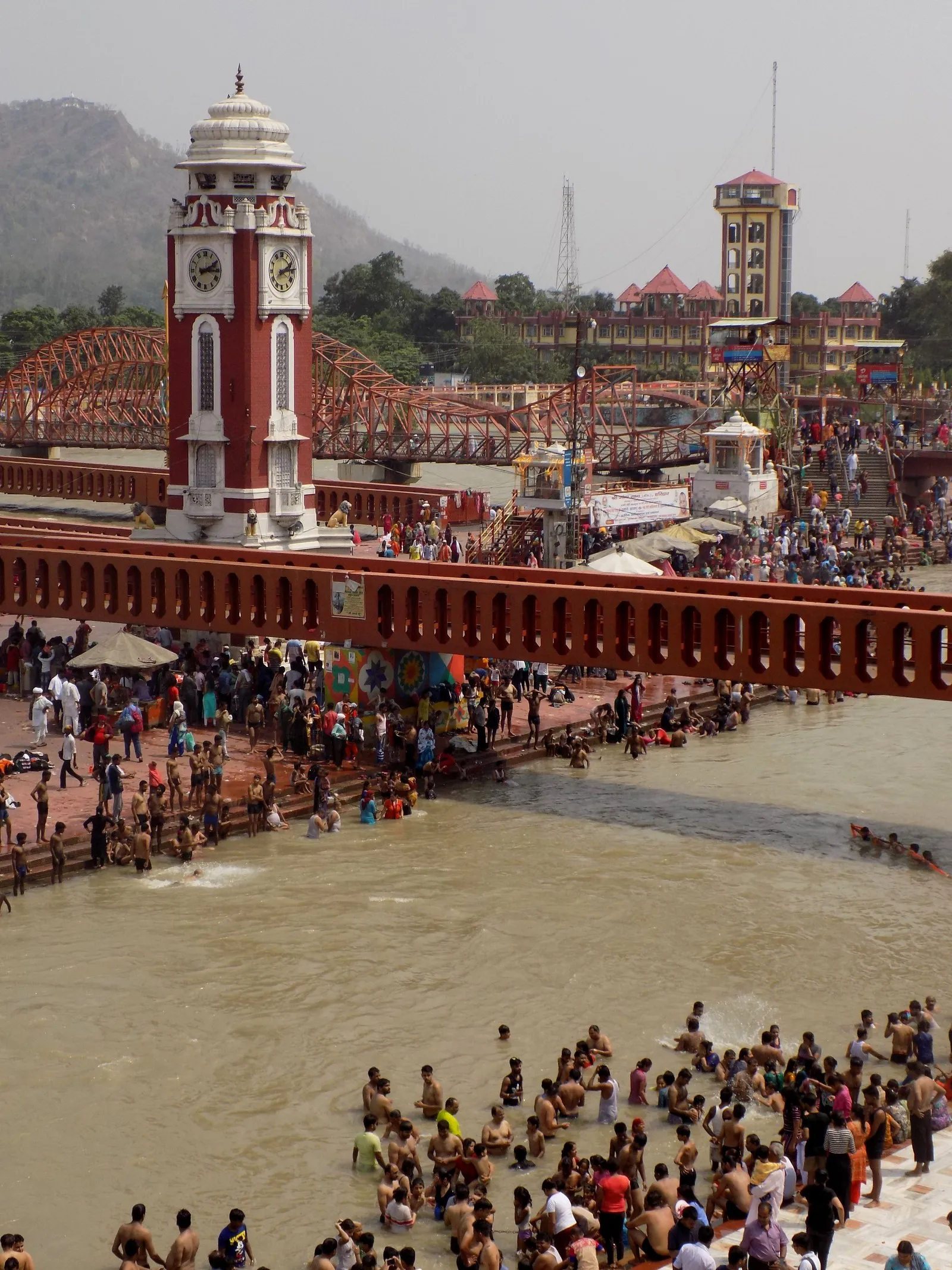 Pilgrims bathing at Har Ki Pauri below the clock tower, Haridwar