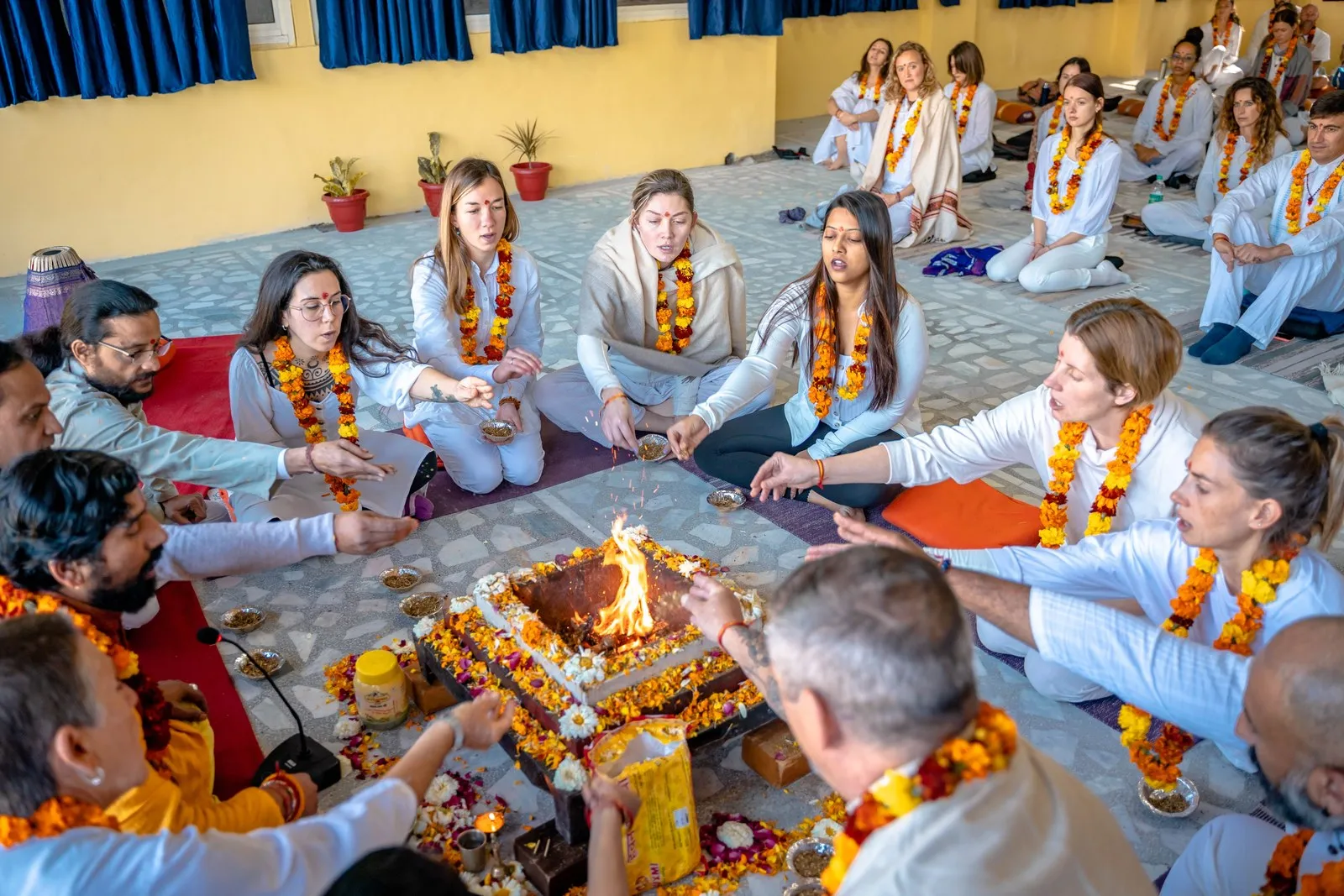 Students garlanded for a havan, the fire ceremony, at a yoga school in Rishikesh