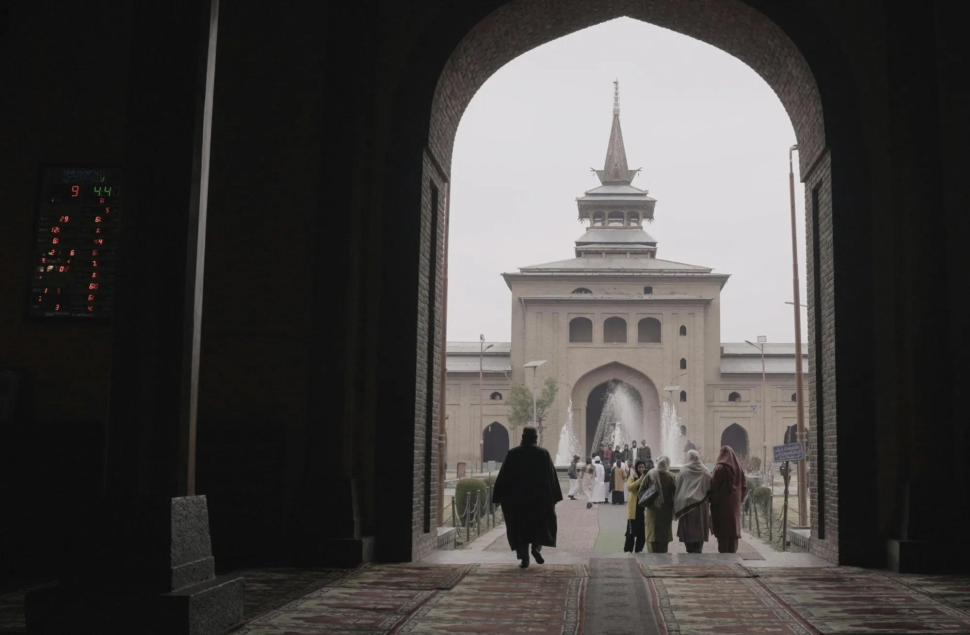 The Jamia Masjid seen through a dark archway