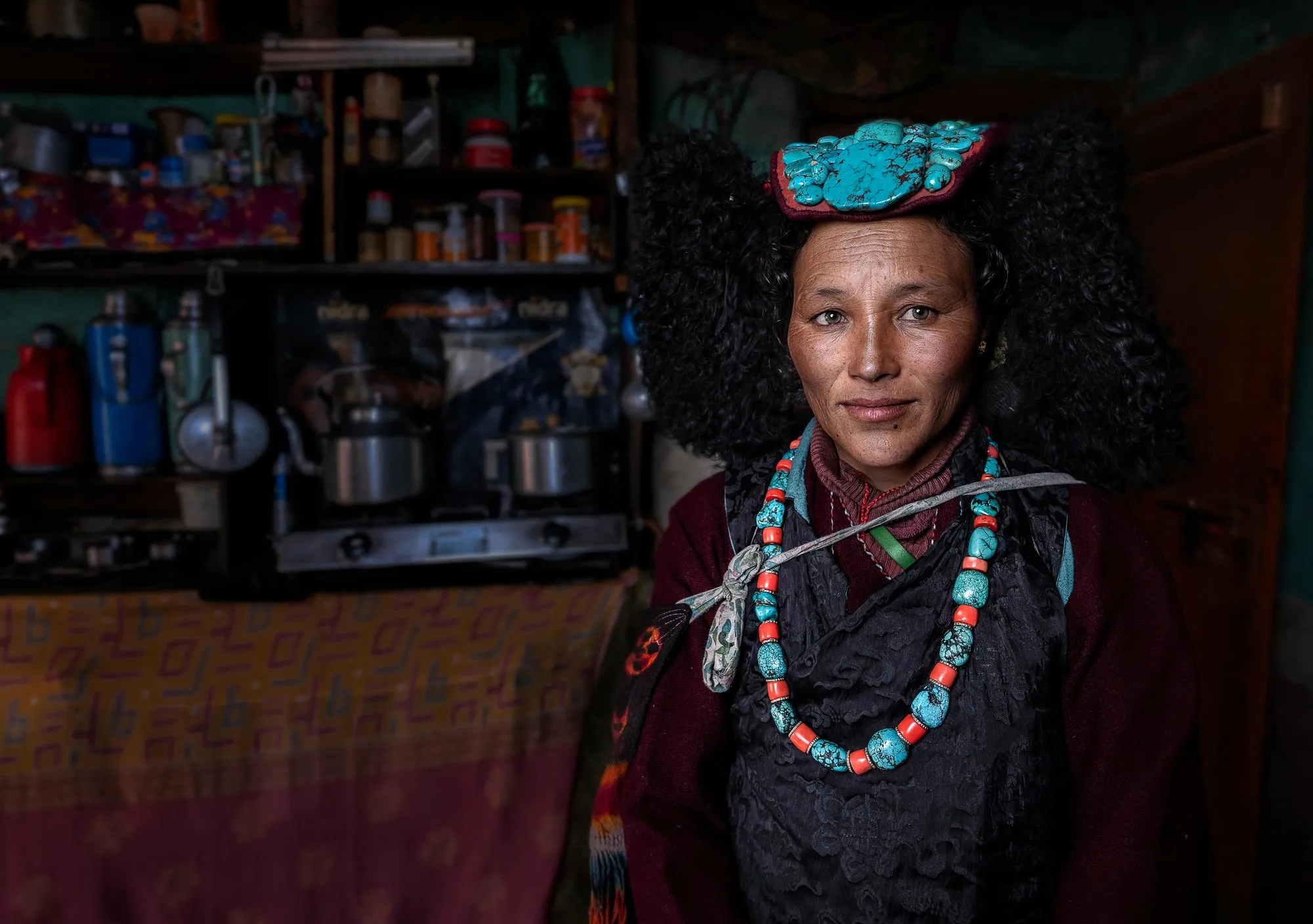 A Ladakhi woman in a turquoise perak and coral necklace
