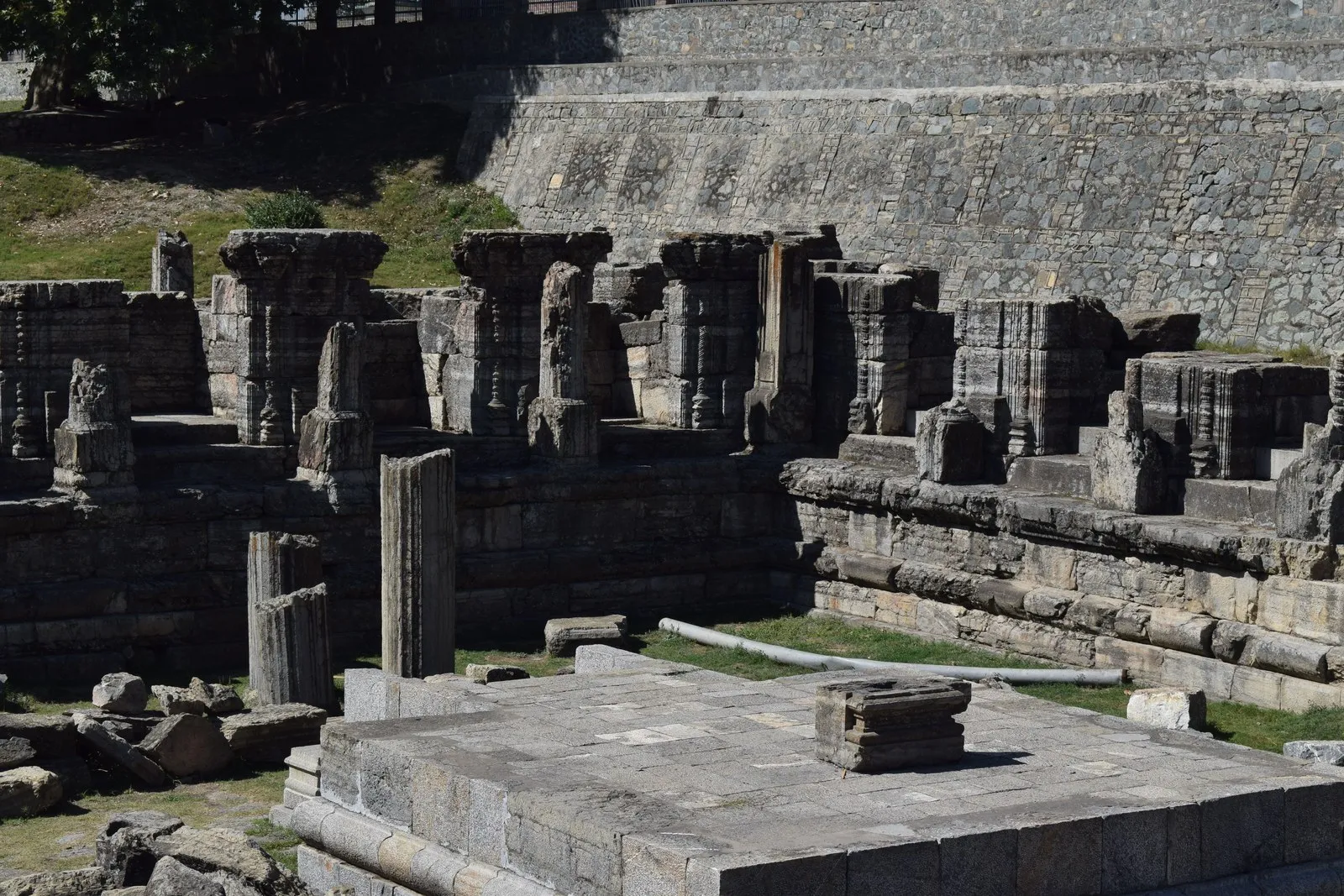 Fluted stone columns and plinths of the ruined Avantiswami temple, Awantipora