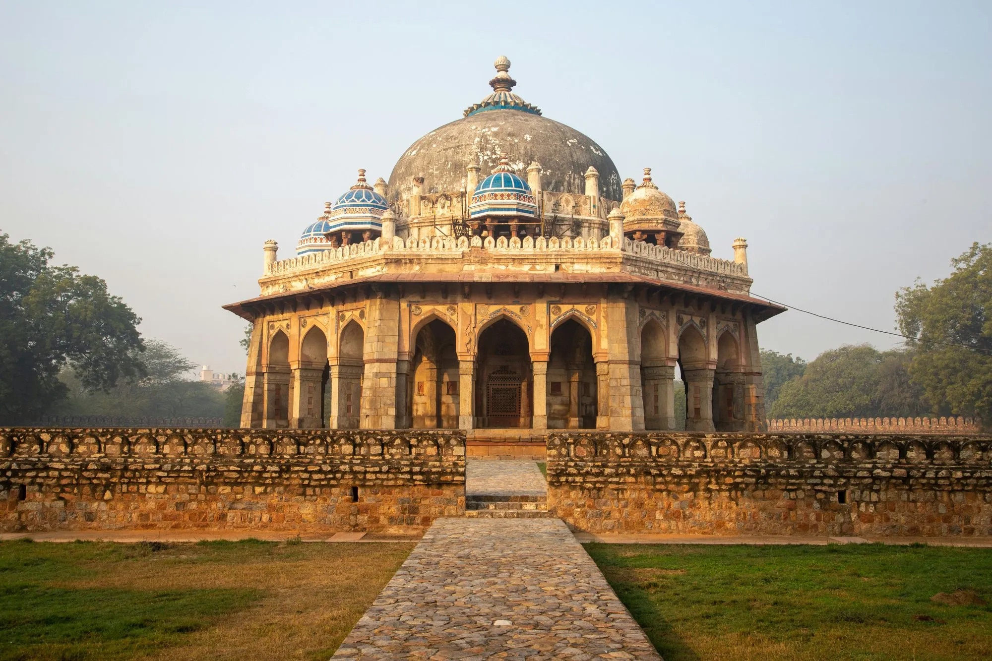 A domed Mughal tomb at the end of a stone path