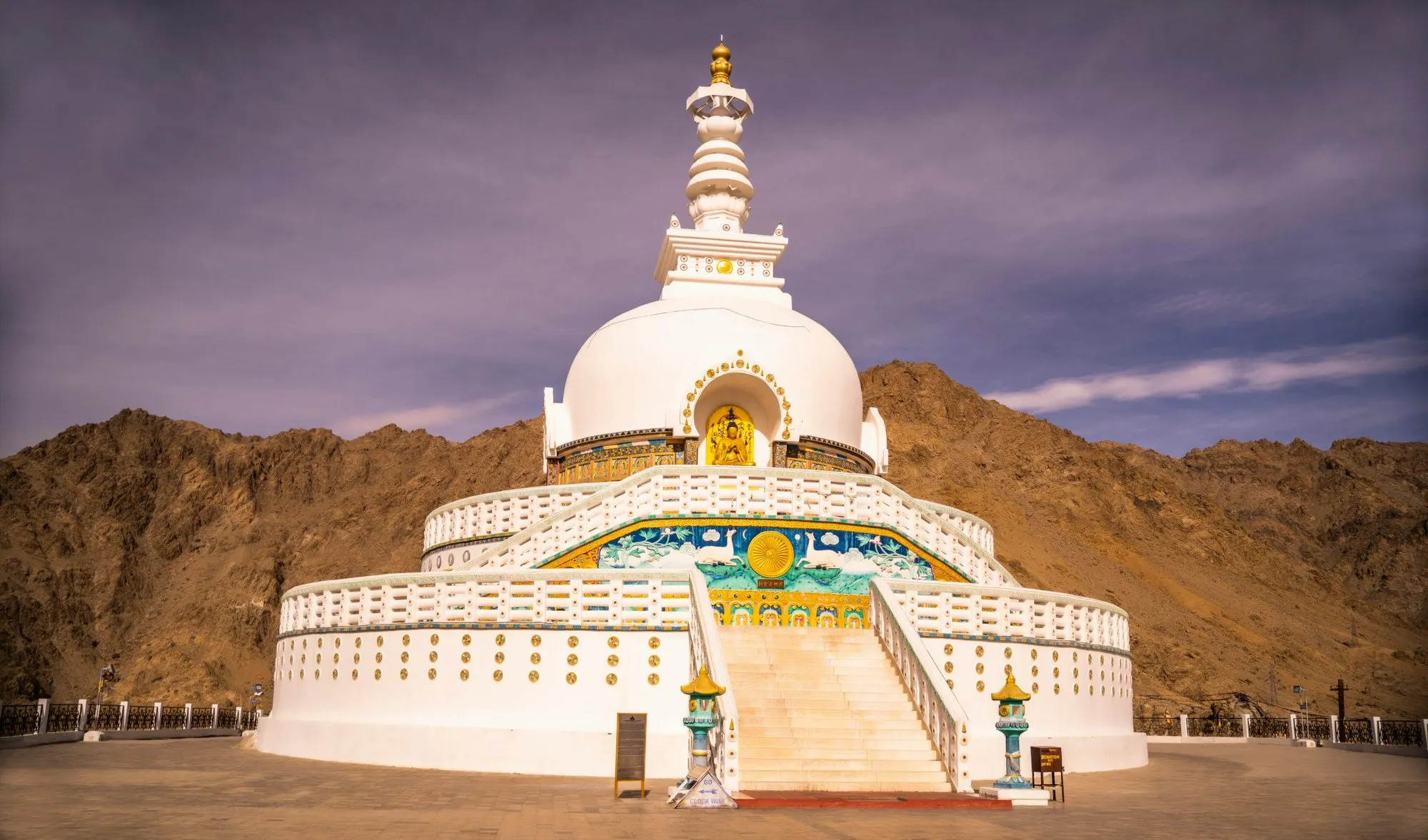 The Shanti Stupa against an evening sky