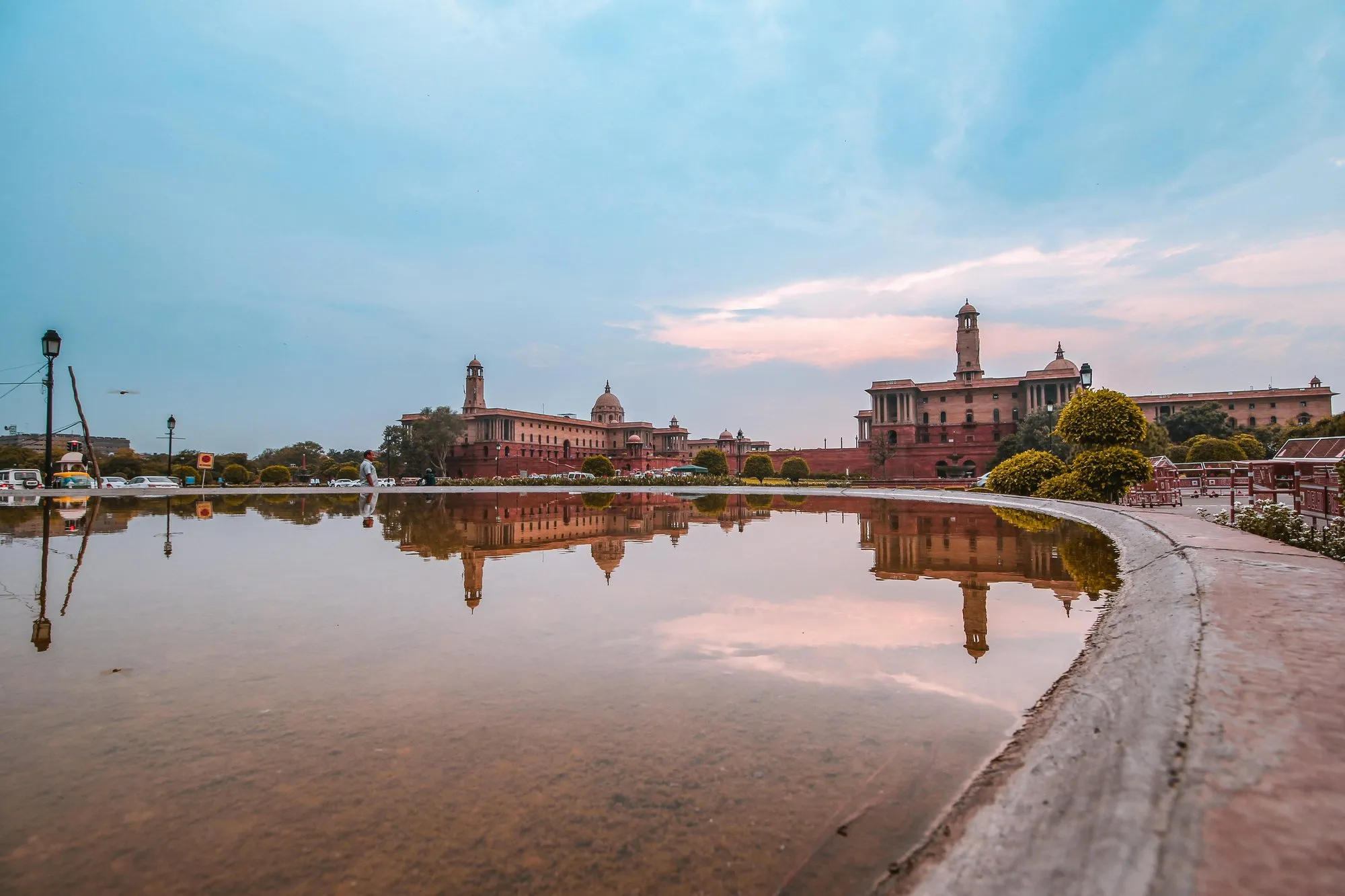 Government buildings in New Delhi reflected in a pool