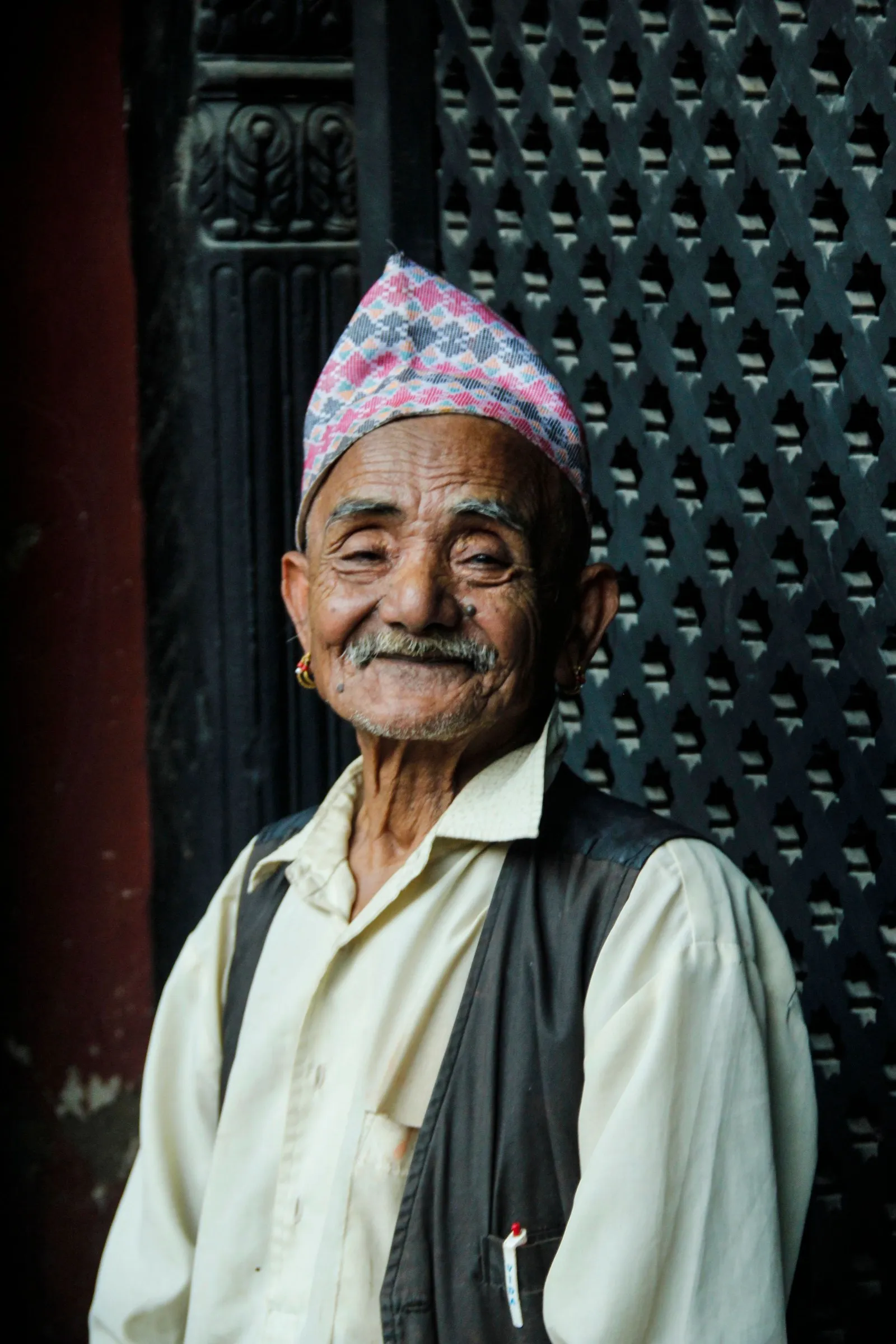An elderly man in a dhaka topi, the Nepali cap, in Patan