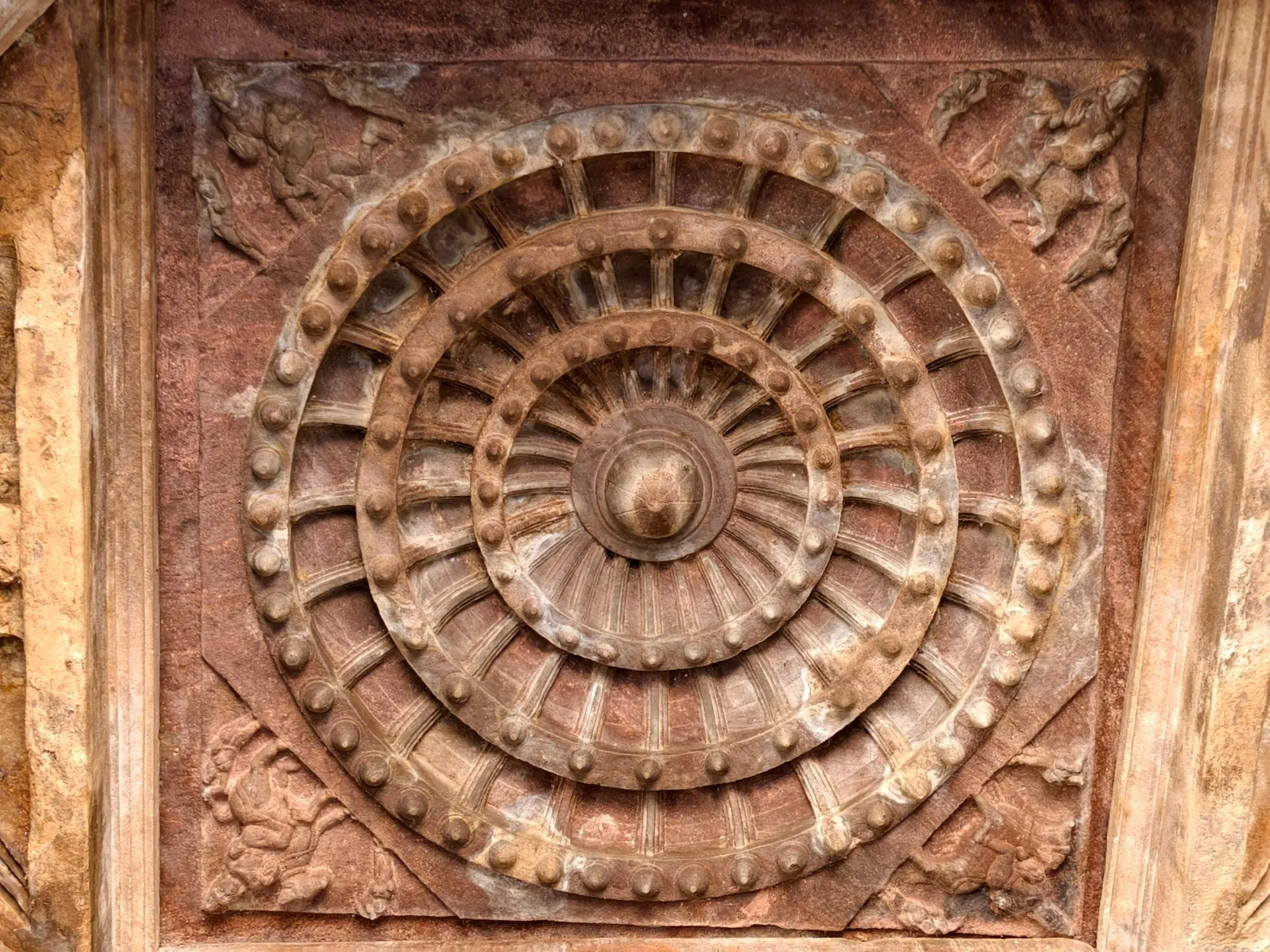 A carved stone lotus medallion