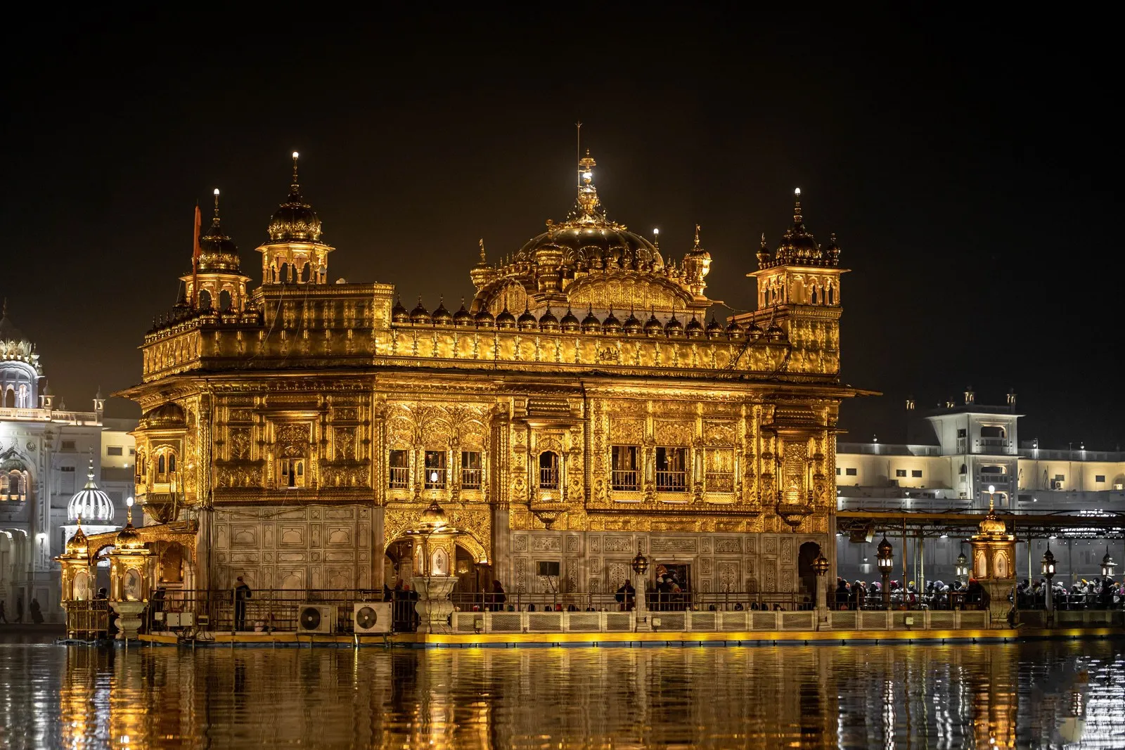 The Golden Temple lit at night and reflected in its sacred pool, Amritsar