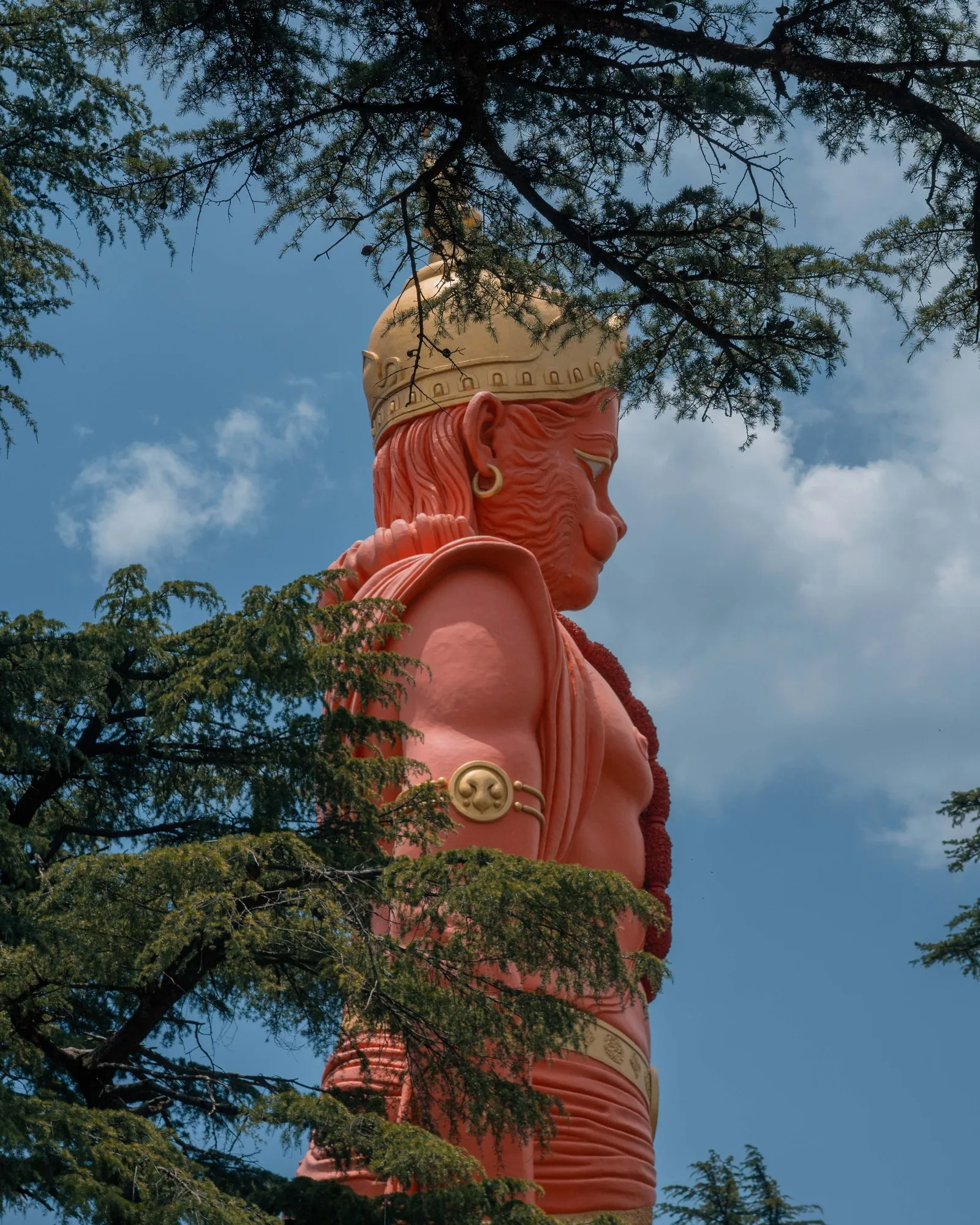 The tall statue of Hanuman among the cedars at the Jakhoo temple, Shimla